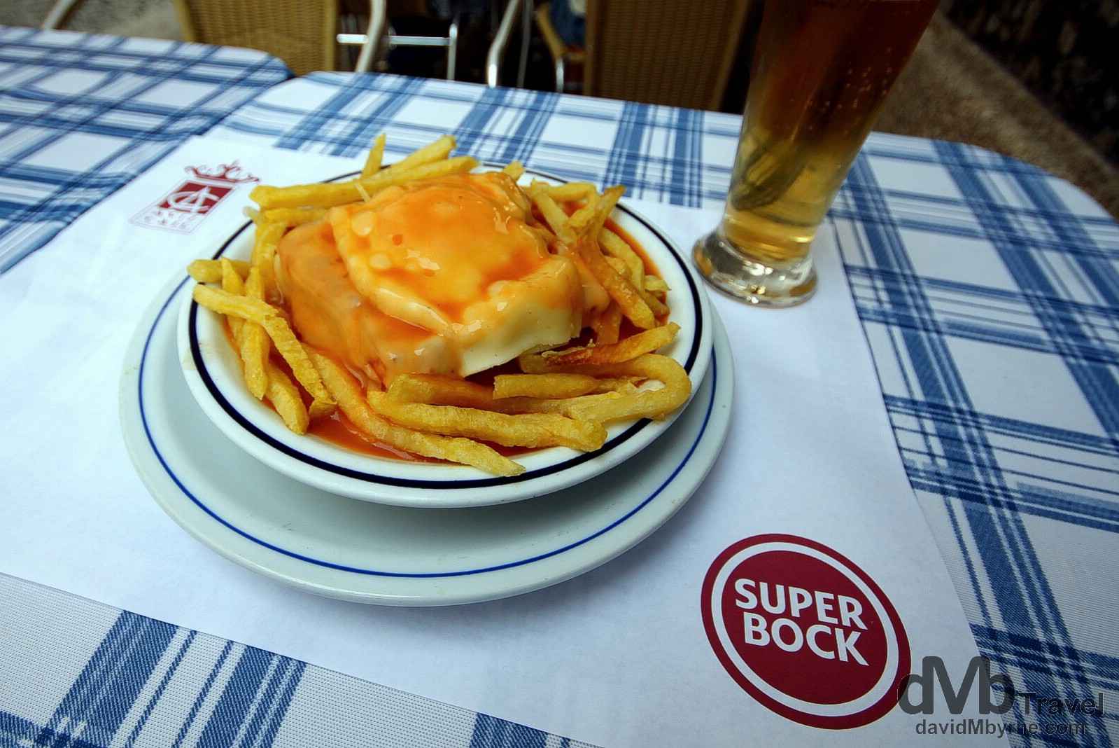 Francesinhas. The Little French Lady, or francesinha as it’s known to the locals, is a Porto 'speciality’ & by the looks of it a heart attack waiting to happen. Invented in the 1960s, it’s a popular dish in Porto while enjoying cult appeal elsewhere. It’s a sandwich, a stacked, messy one eaten with a knife & fork. There is no standard recipe (seemingly anything goes) and upon dissecting my AVIZ Café francesinha I found ham, egg, sausage, cheese & olive-infused luncheon meat, all covered in a red tomoto & beer-based sauce. Served with fries and washed down with a Super Bock is quintessential Porto. AVIZ Café, Porto, Portugal. August 28th 2013.