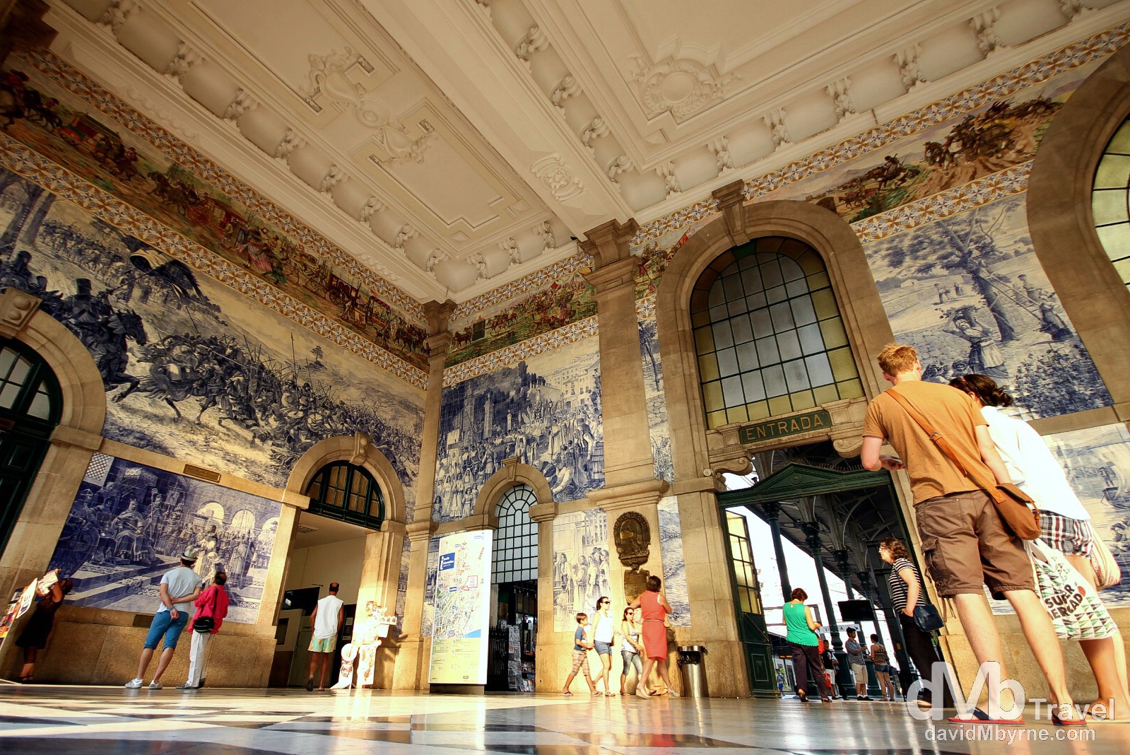 Azulejo in Sao Bento Station. Azulejo is a form of Portuguese painted ceramic tile work that has been produced without interruption for five centuries & has become a typical aspect of Portuguese culture & a major aspect of Portuguese architecture - the tiles are applied on walls, floors, ceilings & even on the streets. Ten years of work went into finishing the 20,000 tiles found here, in the vestibule of the 1916 Sao Bento train station, a tourist favourite in the city. The azulejo panels here were painted between 1905-1916 by Jorge Colaco, the most important azulejo painter of the time, & depict landscapes & important historical scenes in Portuguese history. I visited this station numerous times while in the city (it's somewhere you always seem to pass by) but, and while nurturing a fast depleting camera battery, waited until the nice light of sunset cast a warm glow in the vestibule before photographing it. Porto, Portugal. August 28th 2013.