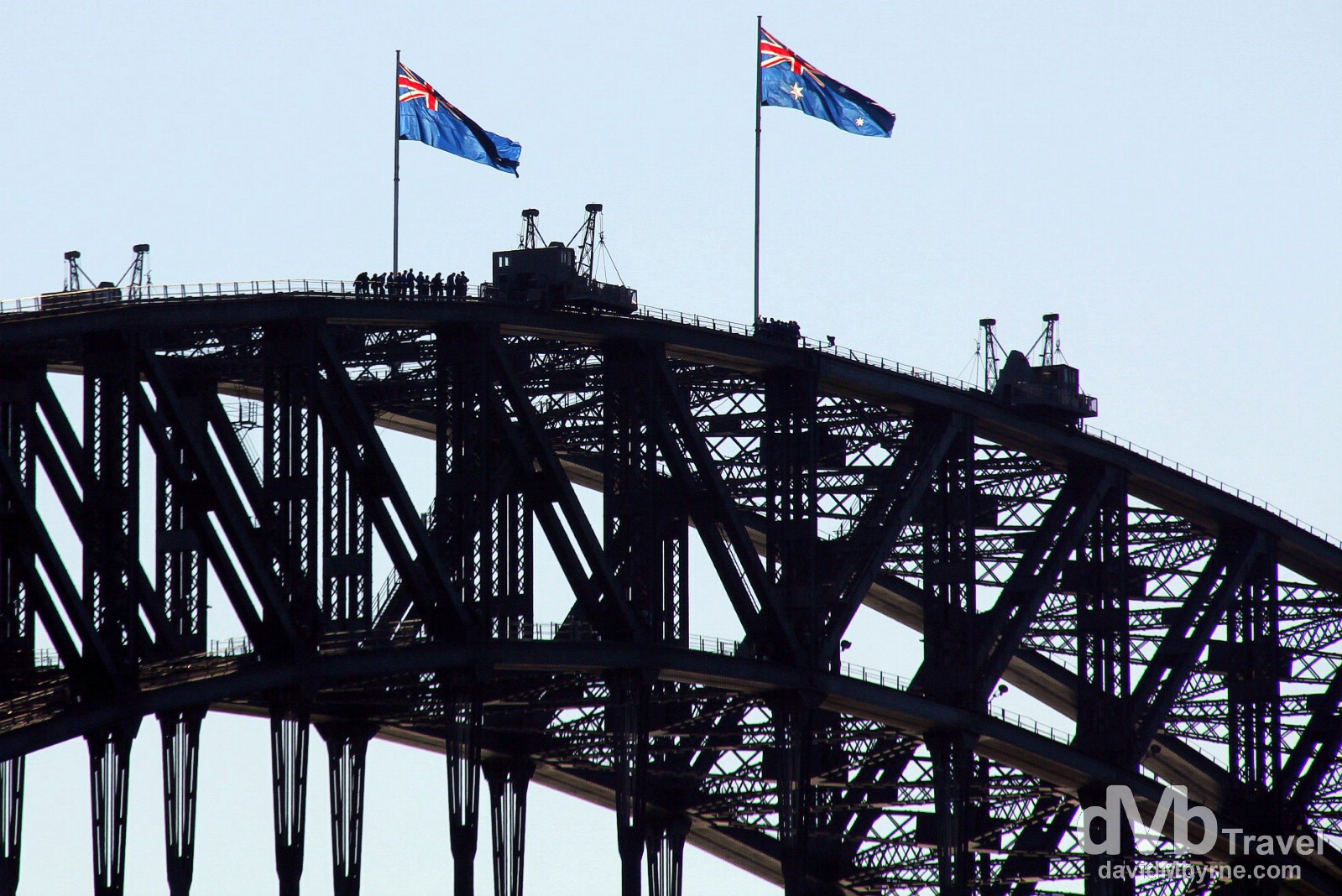 Climbers atop the Sydney Harbour Bridge as seen from the Manly Ferry in Sydney Cove, Sydney, Australia. June 8th 2012. 