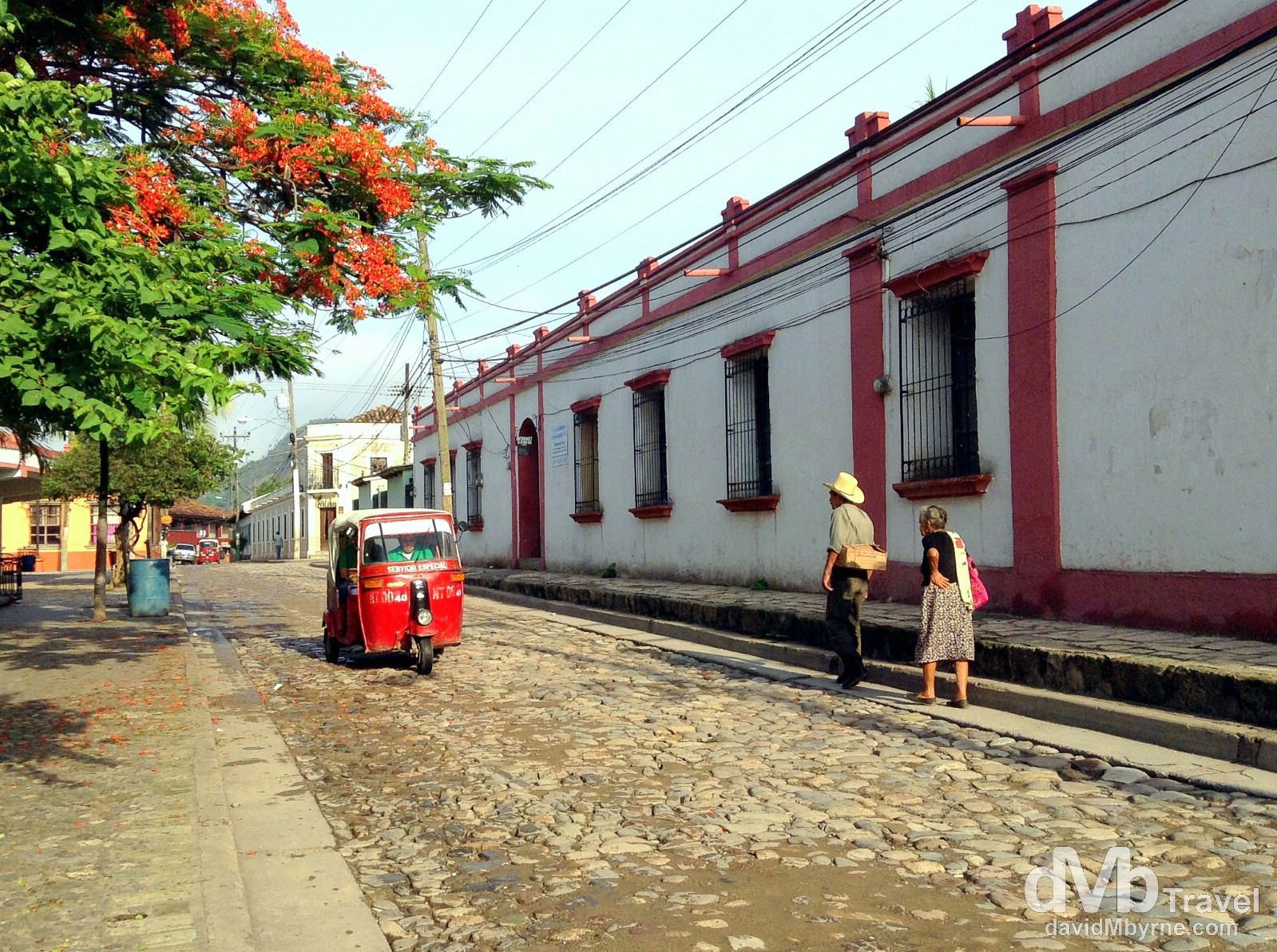 A tuk-tuk & early morning strollers (& shadows) on the cobbled streets of Copan Ruinas, western Honduras. June 8th 2013. (iPod)