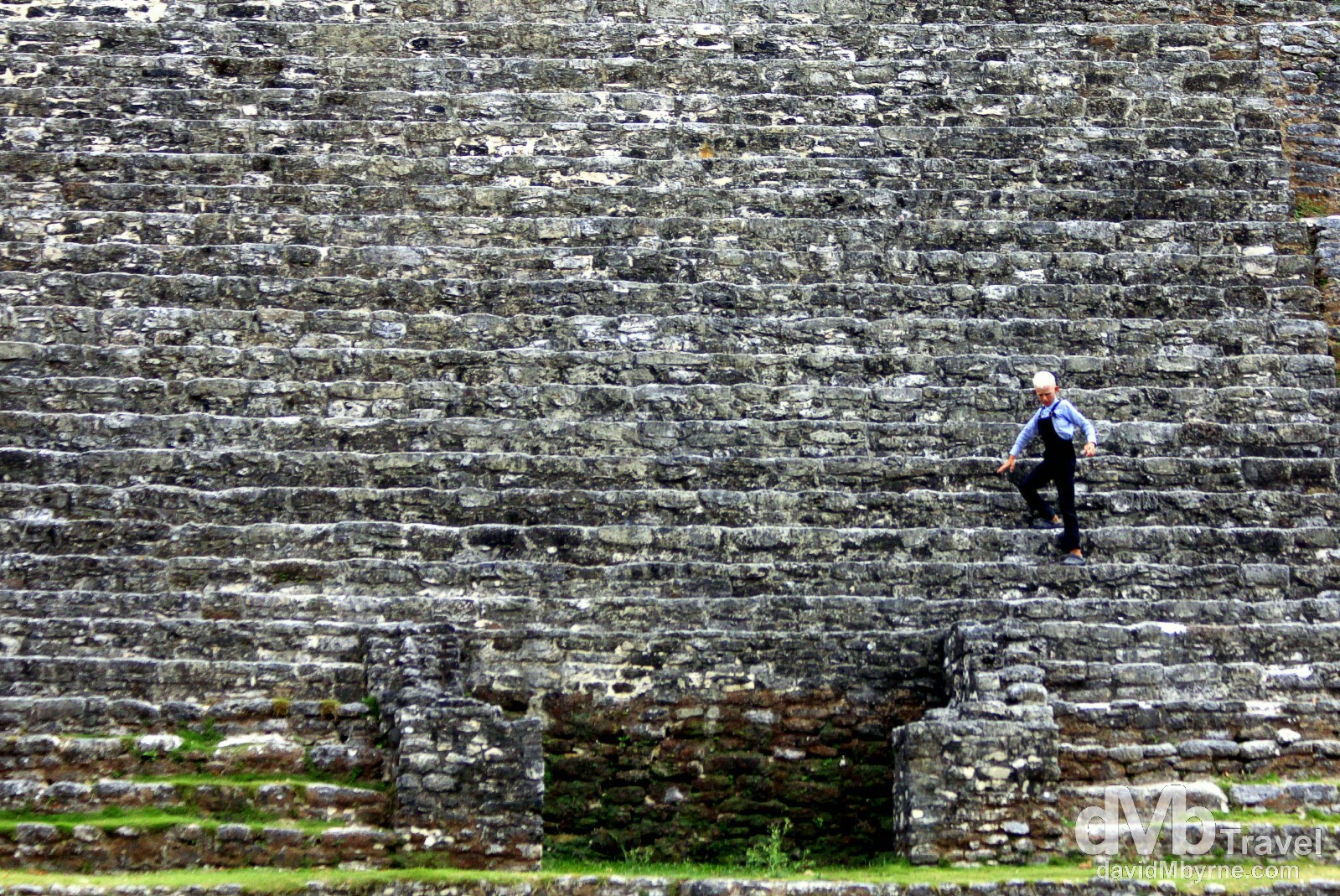 A Mennonite boy descends the steps of the Jaguar Temple at the Lamanai Mayan ruins in Central Belize. May 11th 2013. 