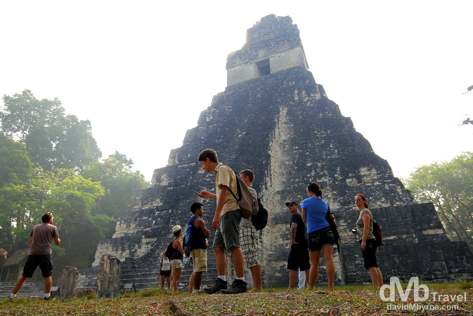 People in front of Temple 1, Temple of the Grand Jaguar in The Gran Plaza, Tikal Mayan ruins, Tikal National Park, northern Guatemala. May 17th 2013.
