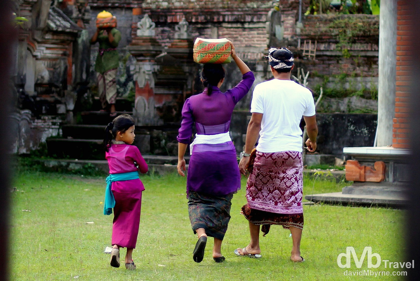 A family in the grounds of banjar (temple), Singakerta, Ubud, Bali, Indonesia. June 16th 2012. 