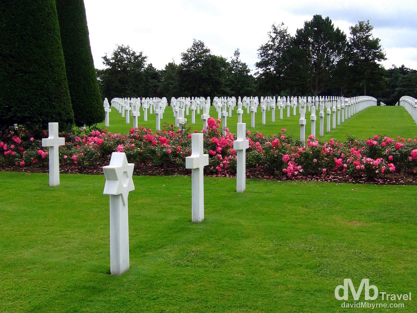 The American War Cemetery in Normandy, France, recognisable from the opening scenes of the 1998 WWII movie 'Saving Private Ryan', overlooks Omaha beach, the D-Day beach stormed by the Americans and the beach that saw the most intense fighting and accounted for most of the D-Day causalities. This sombre place is the final resting spot for just under 10,000 soldiers who died in the overall battle of Normandy. They are buried under solid white marble crosses in orderly rows set among the most impeccably manicured lawns I've ever seen. The site is 720 acres in size, land that was, at the end of the war, given to the Americans by the French government in perpetuity. American War Cemetery, Colleville sur mer, Normandy, France. August 16th 2007.