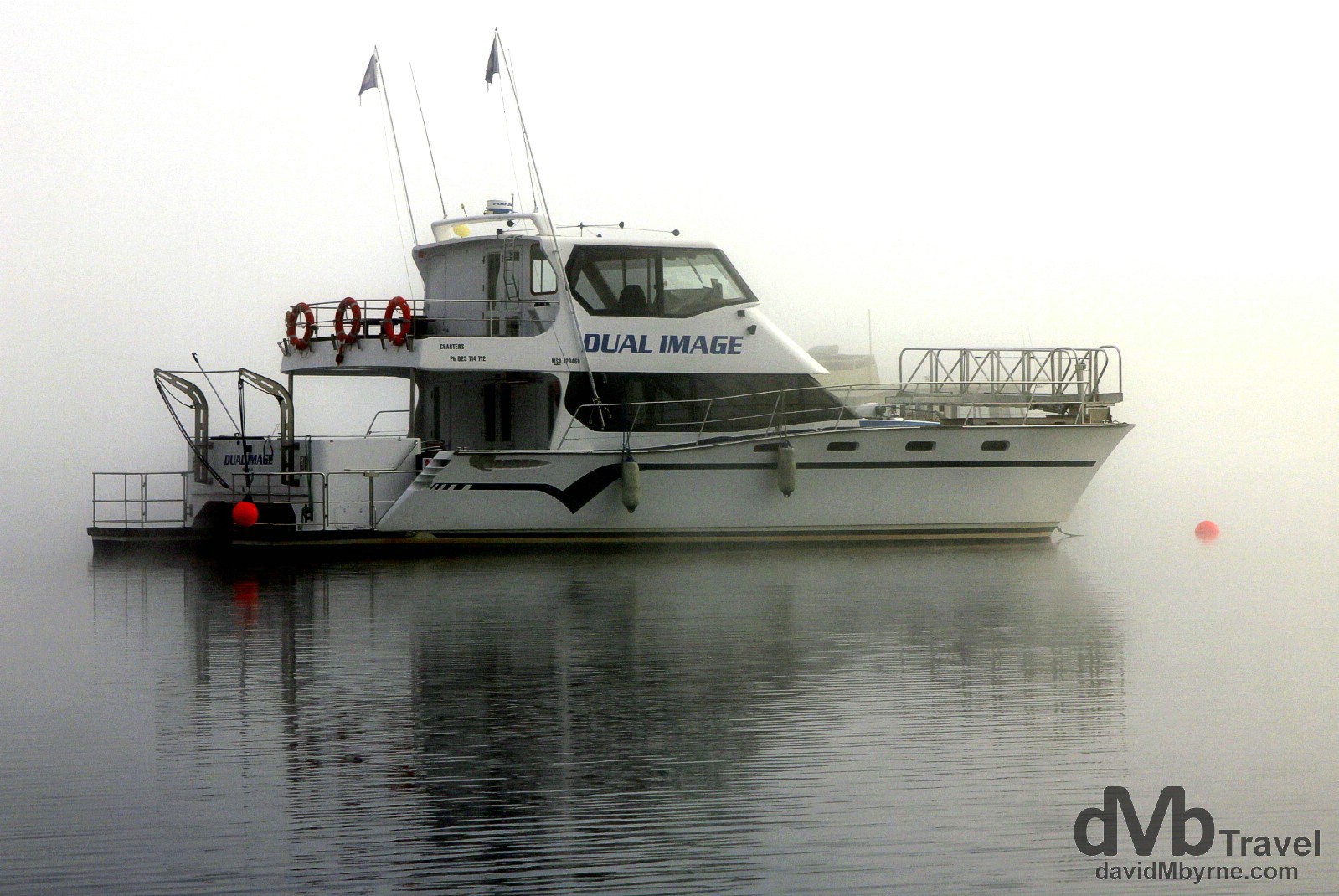 Pleasure craft moored on a misty Lake Wanaka, South Island, New Zealand. May 22nd 2012.