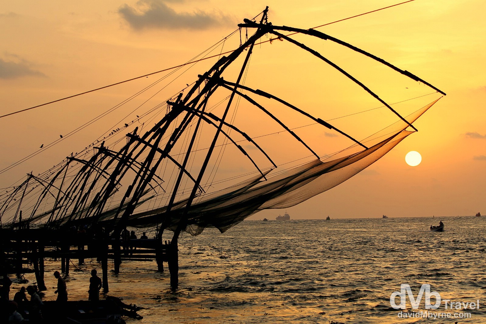 Chinese fishing nets at the tip of Fort Cochin at sunset, Kerala, India. September 19th 2012.