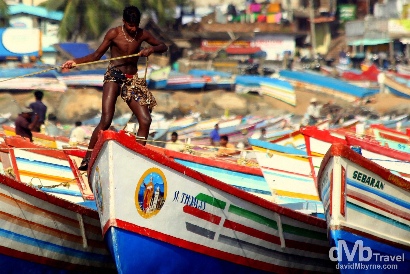 Working with boats in a fishing village outside of Kovalam, Kerala, southwestern India. September 13th 2012.