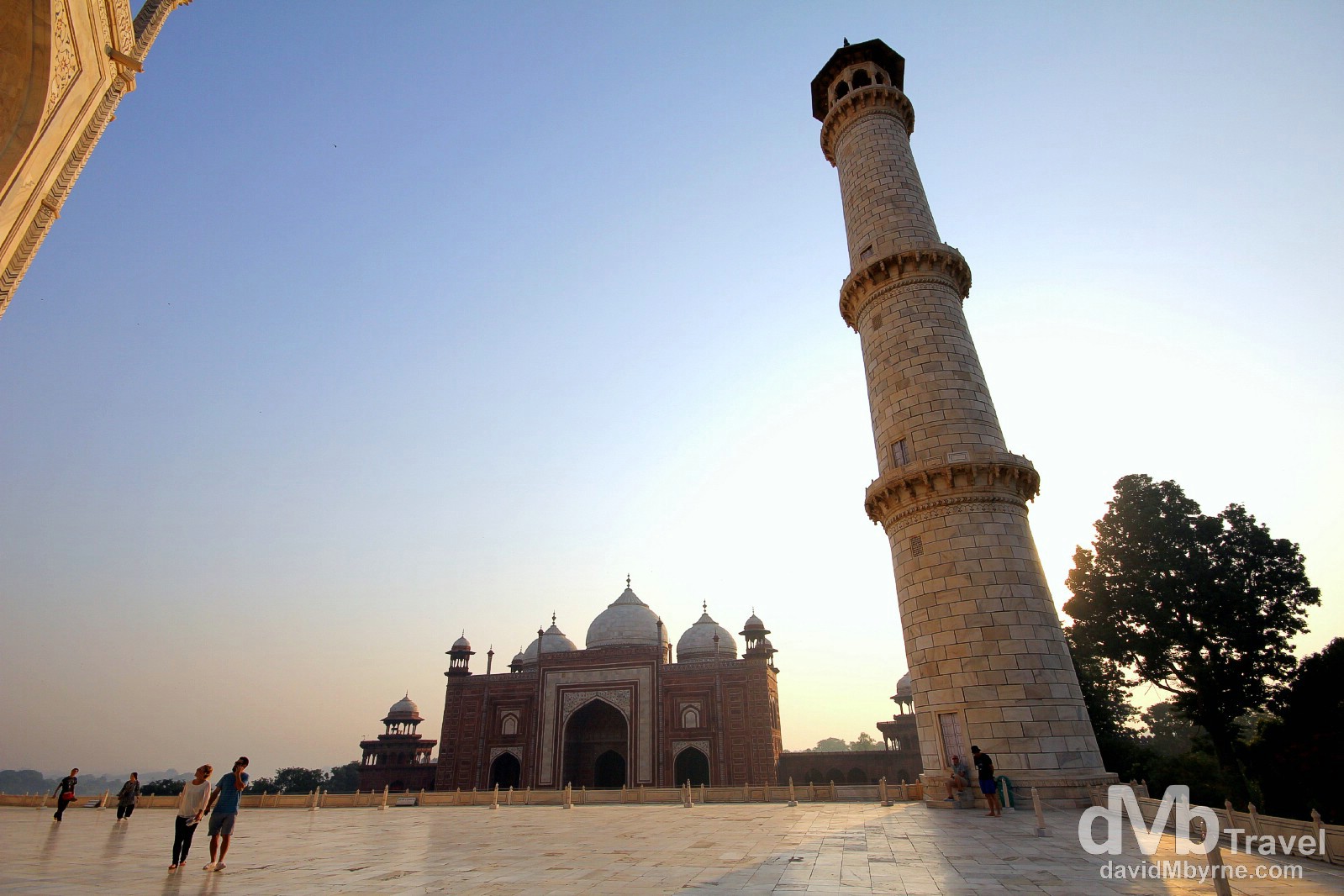 The rising sun is blocked by a minaret on the south-eastern corner of the raised marble platform upon which sits the Taj Mahal, Agra, Uttar Pradesh, India. October 11th 2012.
