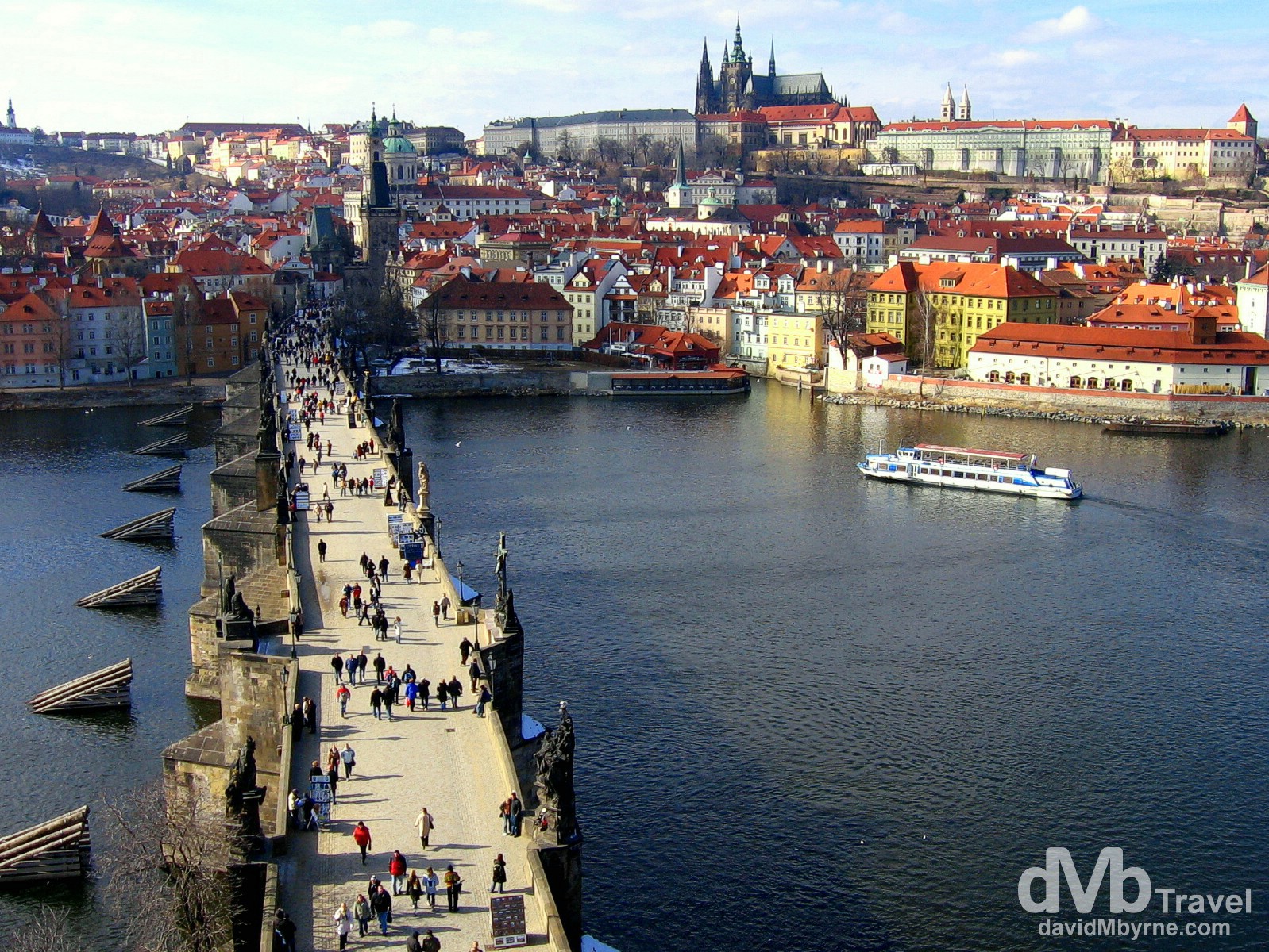 The medieval castle district across the Charles Bridge spanning the Vltava river in Prague, Czech Republic. March 8th 2006