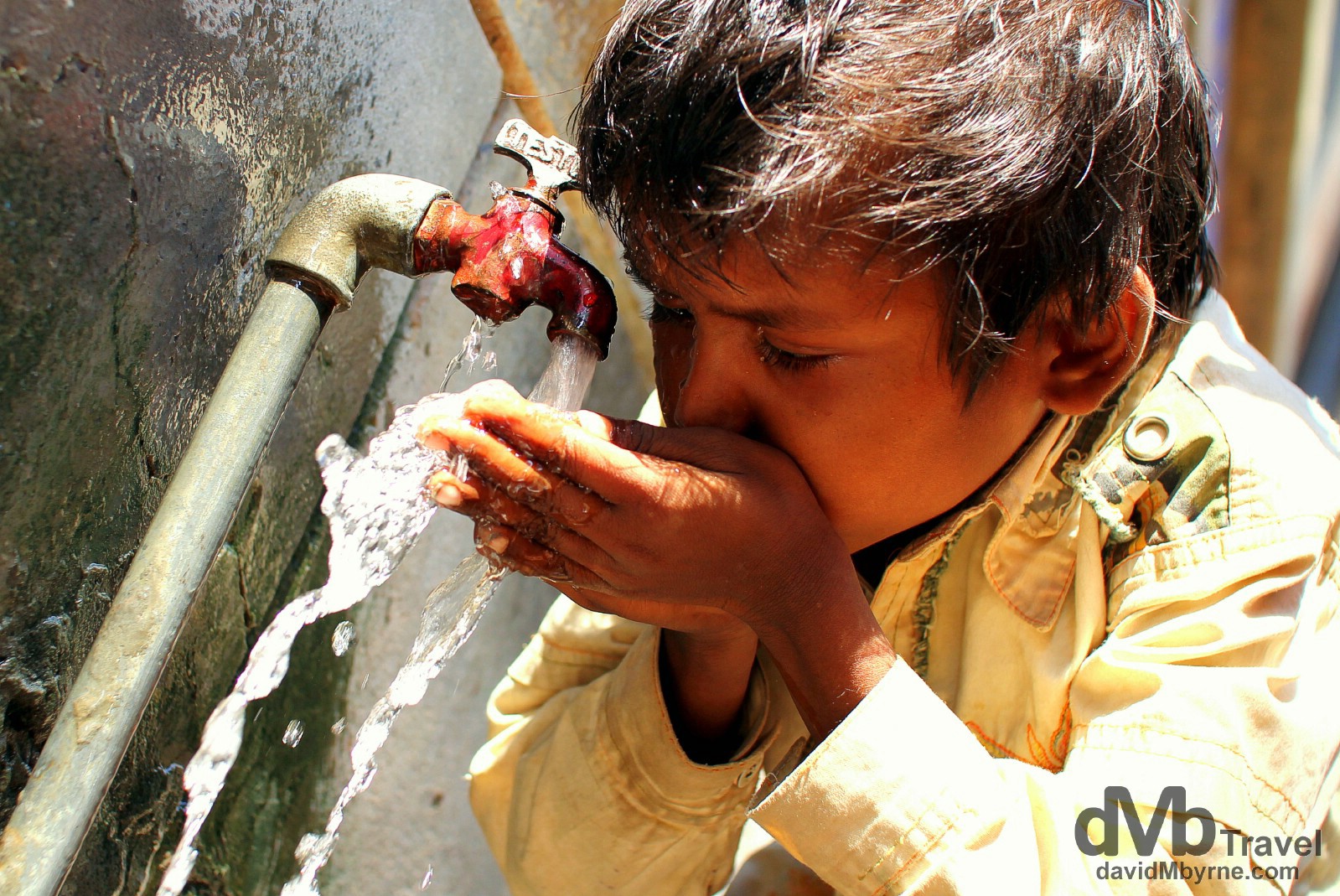 Rehydrating in the narrow lanes of old town Varanasi, Uttar Pradesh, India. October 13th 2012.