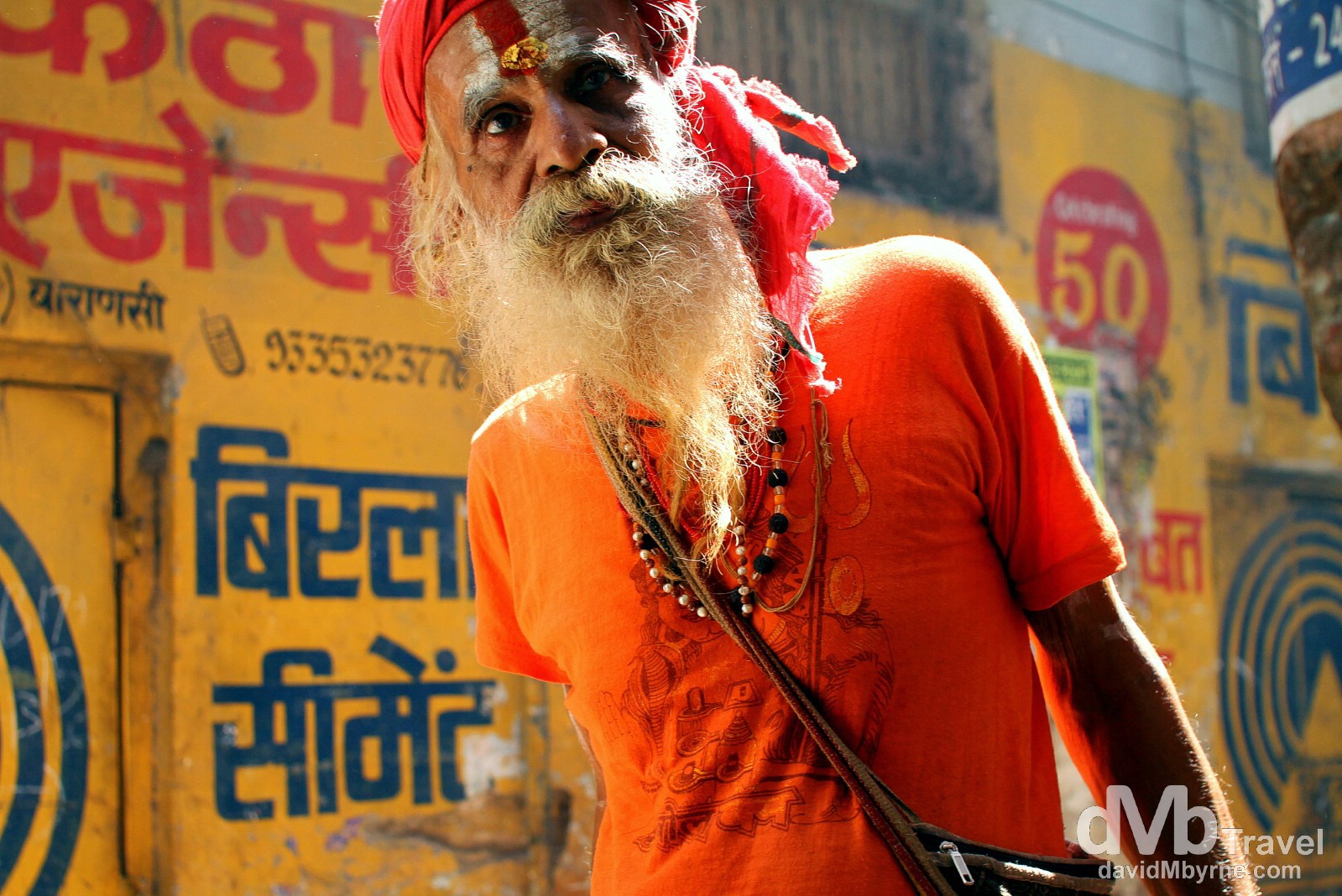 A sadhu, an ascetic Hindi holy man, in the narrow lanes of old town Varanasi, Uttar Pradesh, India. October 13th 2012.