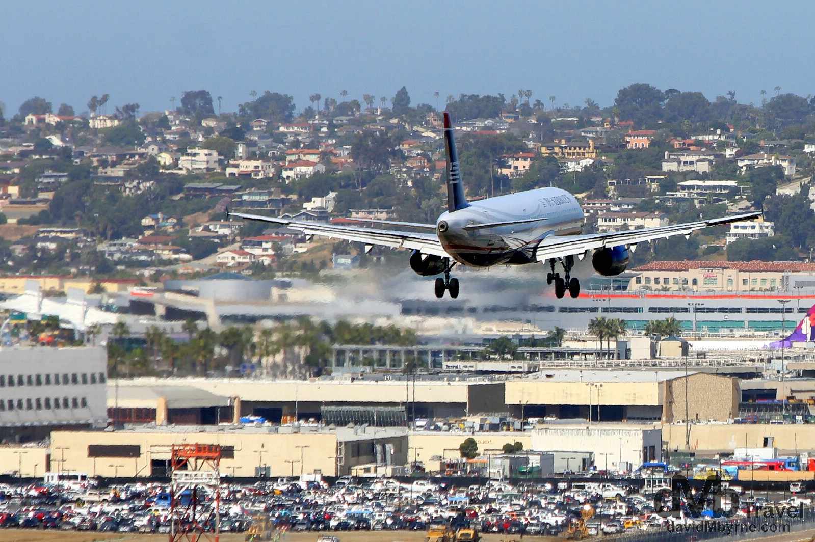 A plane coming in to land at San Diego International Airport as seen from Laurel Street. San Diego, California, USA. April 17th 2013.