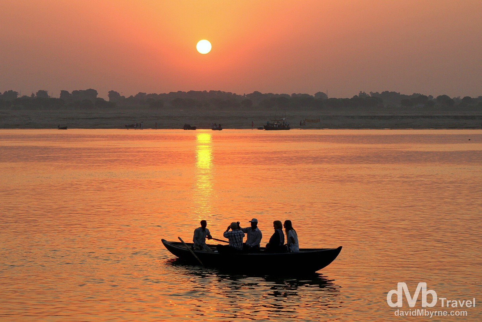 A tourist boat on the Ganges River at sunrise. Varanasi, Uttar Pradesh, India. October 13th 2012.