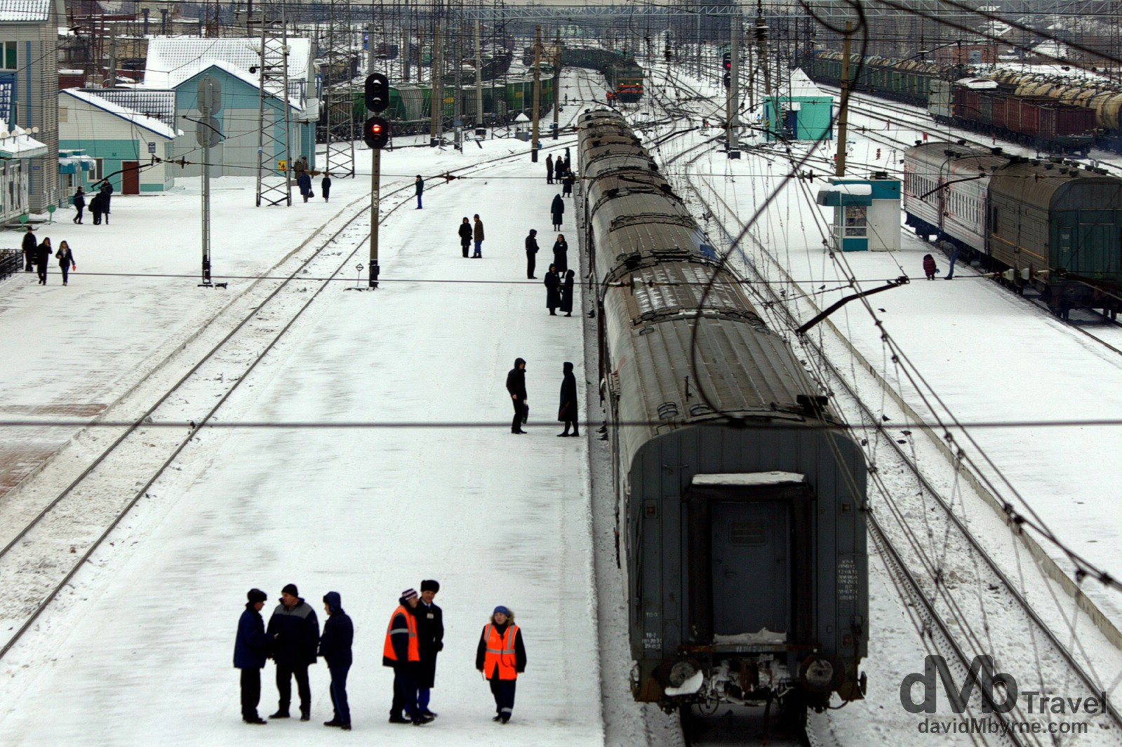 Train 037, minus its locomotive, sitting in Tayga train station as seen from a bridge spanning the station tracks. Tayga, Siberian Russia. November 12th 2012.