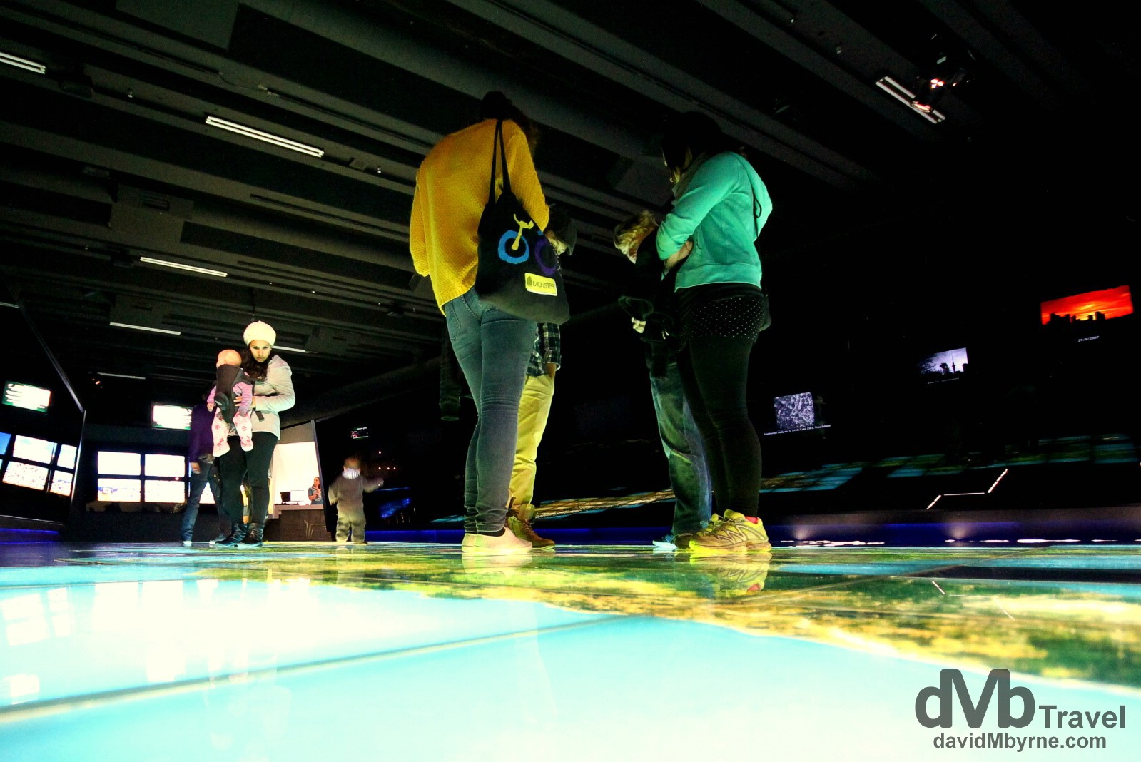 Visitors examining a huge illuminated floor map in Te Papa, Wellington, North Island, New Zealand. May 12th 2012.