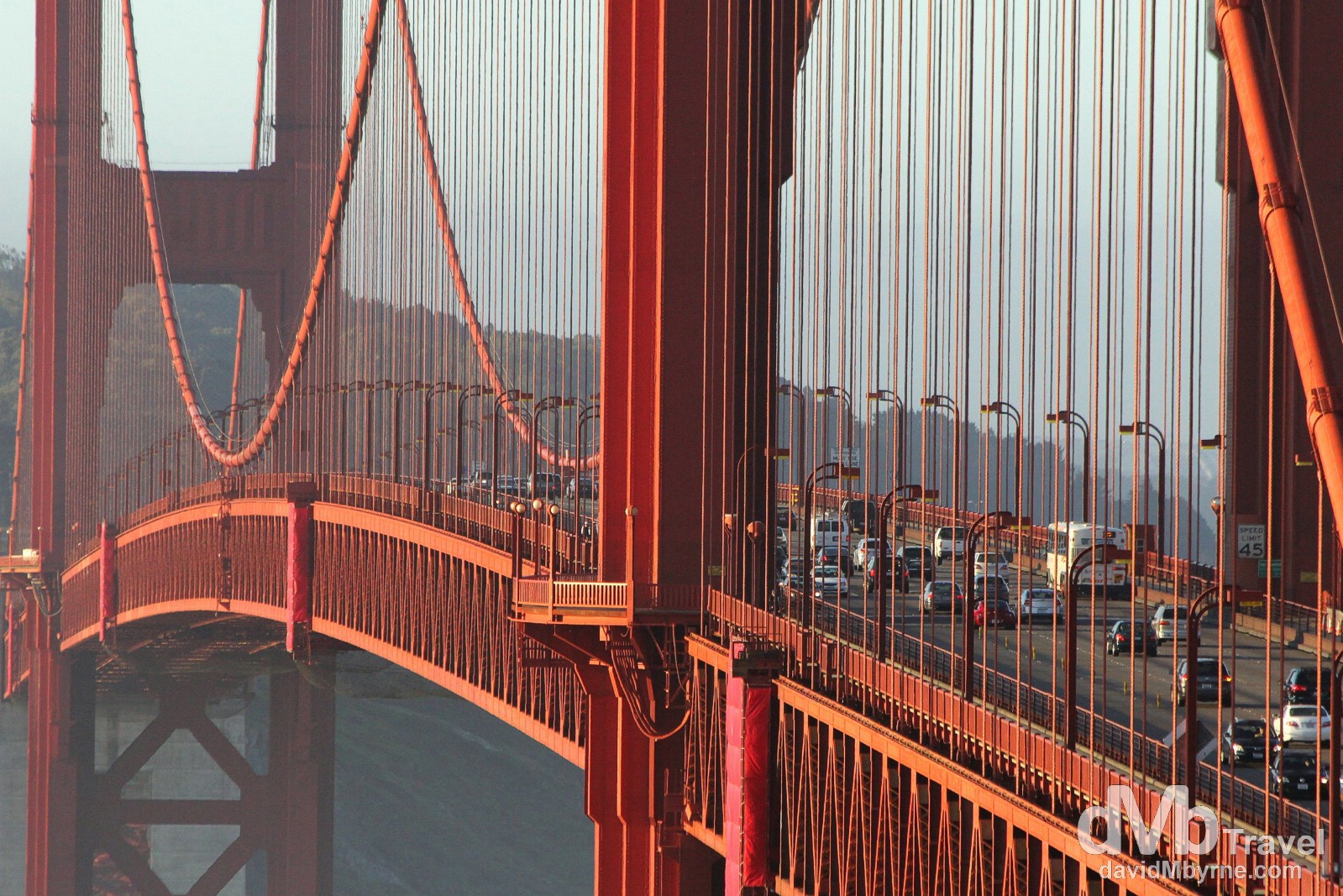 Sunrise light illuminates the span of The Golden Gate Bridge as seen from Vista Point on the north-eastern side of the bridge. San Francisco, California, USA. April 11th 2013.