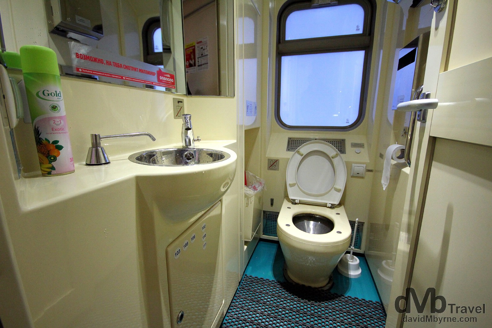 Yes, it's a toilet, the one at the end of my train carriage. Everything is clean & works. And there’s even air freshener. The toilet is one of those noisy suction jobs found on aeroplanes meaning, & unlike older rolling stock which simply discards whatever is deposited right onto the tracks, toilets are not locked in the vicinity of stations. Nirvana for some. On the train from Tomsk to Nizhny Novgorod, Russia. November 14th 2012.