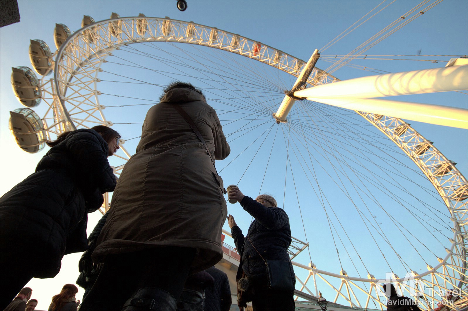 Standing under the London Eye Ferris wheel on the banks of the Thames River in London, England. December 8th 2012. 