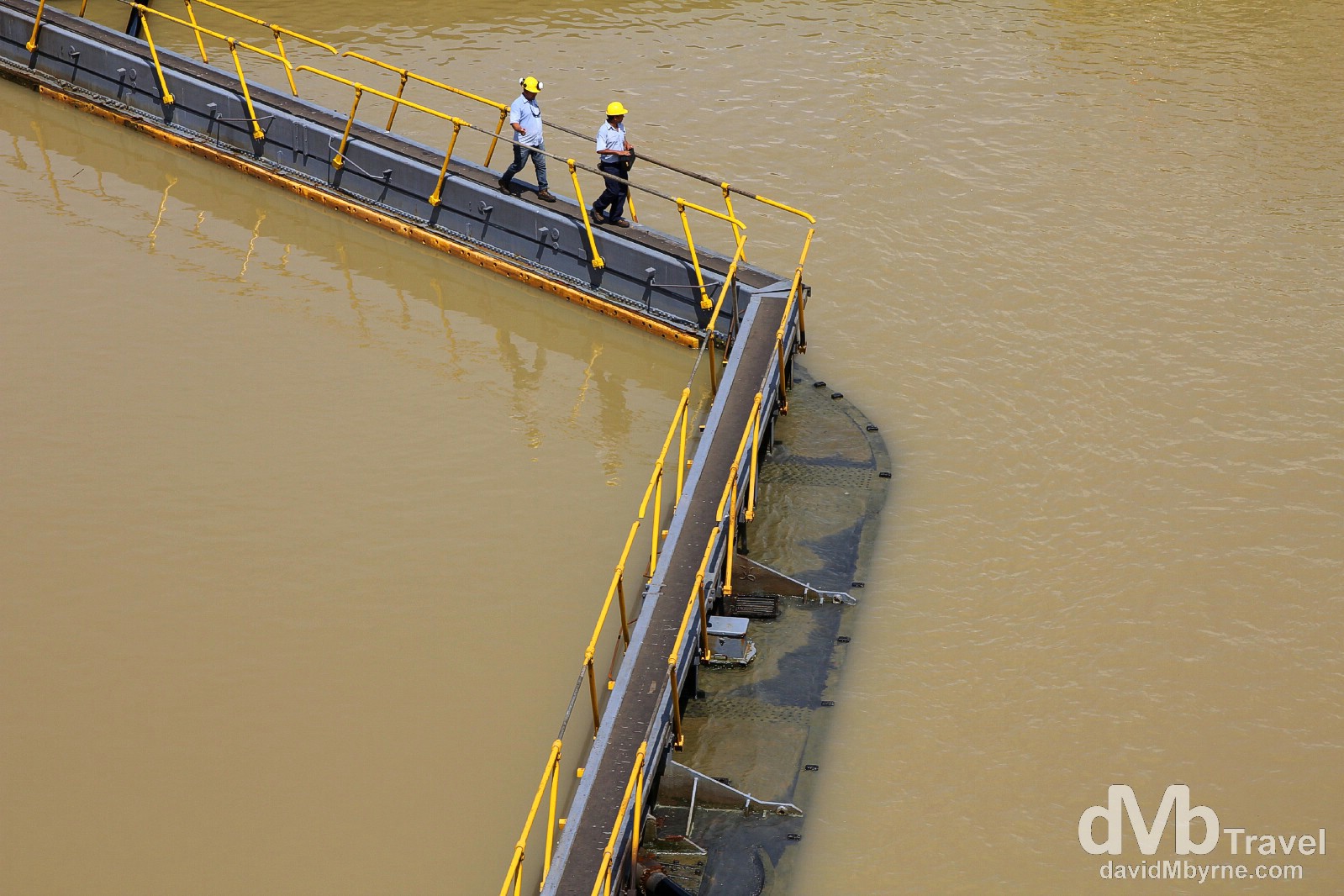 Workers crossing the Miraflores Locks of the Panama Canal, Panama. July 1st 2013.