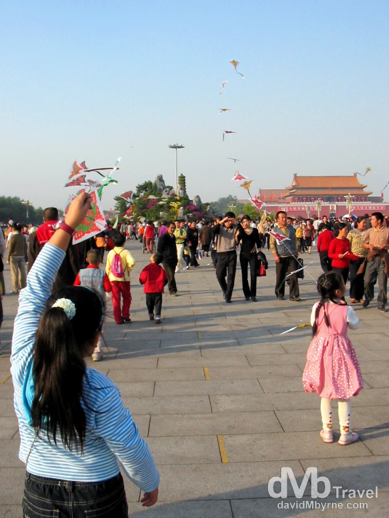Flying kites in Tiananmen Square during National Day Golden Week celebrations. Tiananmen Square, Beijing, China. October 3rd, 2004