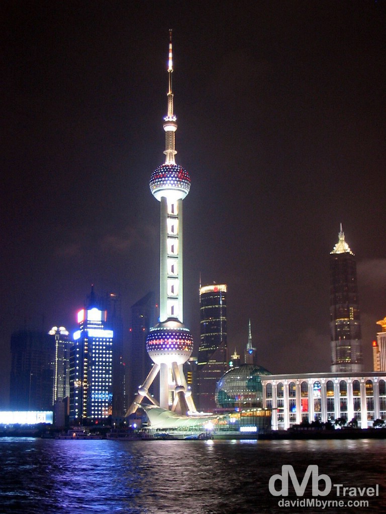 Oriental Pearl TV Tower in the New Pudong area of the city as seen from the Bund across the Huangpu River in Shanghai, China. August 31st, 2004.
