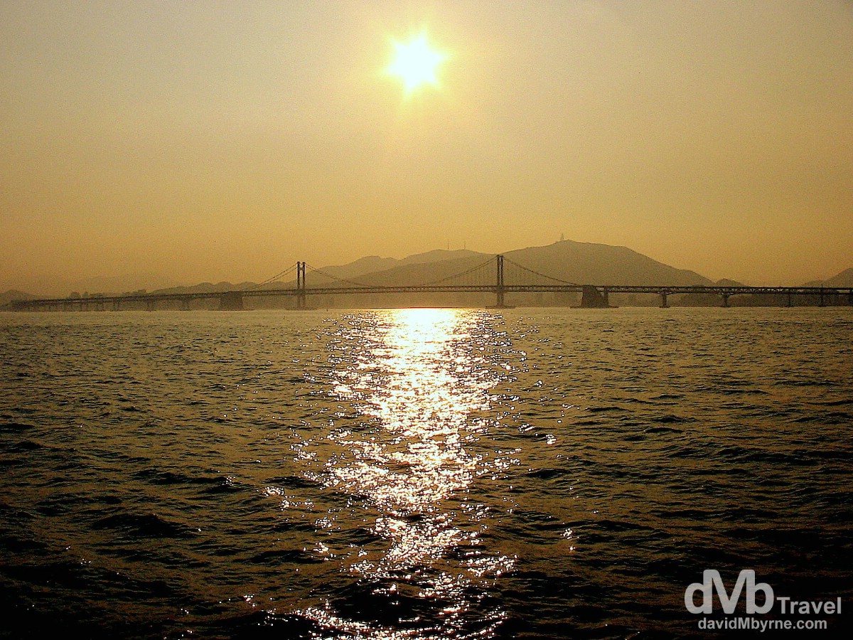 Sunset over the Gwangan Bridge as seen from the Oryukdo Ferry. Busan, South Korea. July 21st, 2004