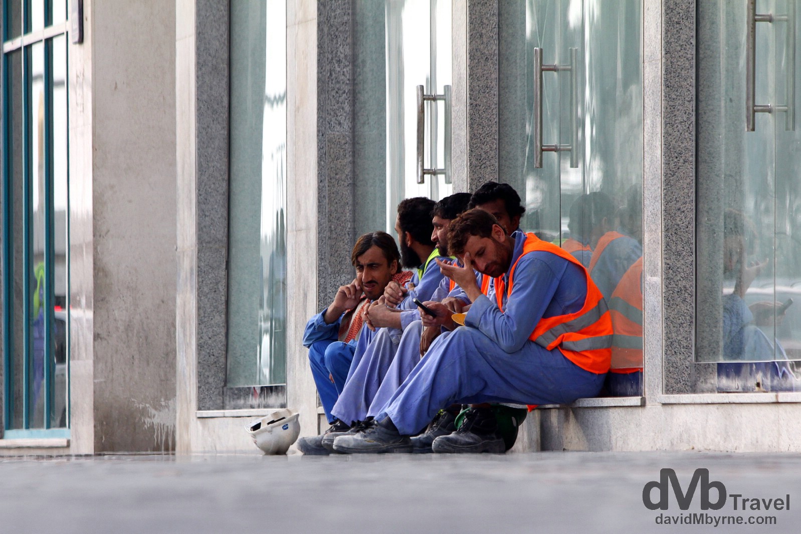 Constructions workers on the streets of Abu Dhabi after days work in the desert heat. Abu Dhabi, UAE. April 23rd, 2014.