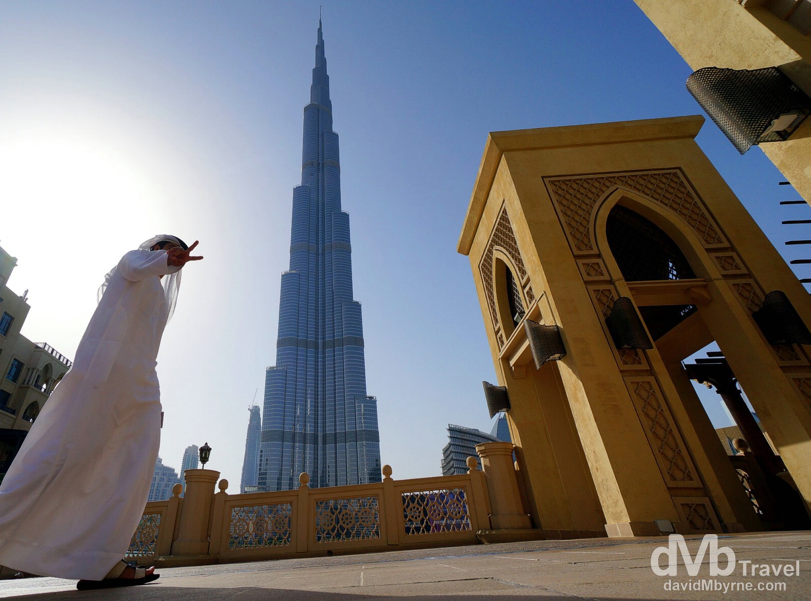 V sign at the base of the 829.8-metre Burj Khalifa, the tallest building in the world. Dubai, UAE. April 14th, 2014.