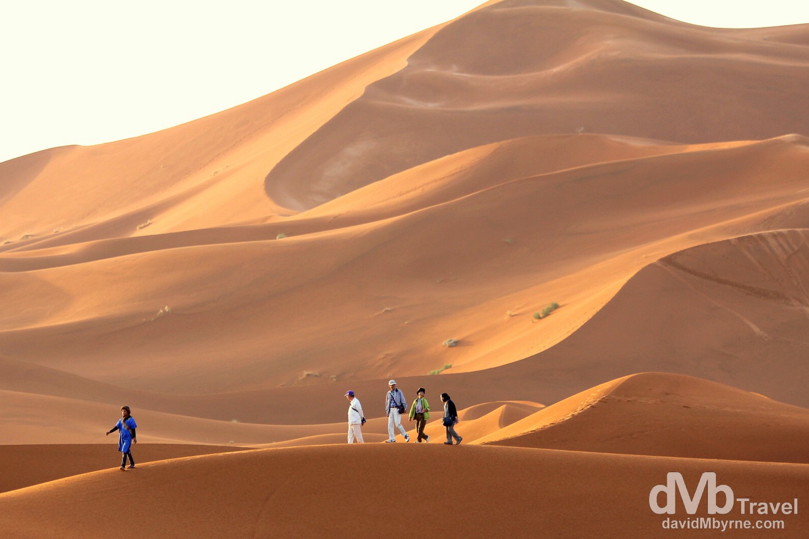 An early morning stroll among the massive sand dunes of Erg Chebbi in Morocco. May 19th, 2014. 