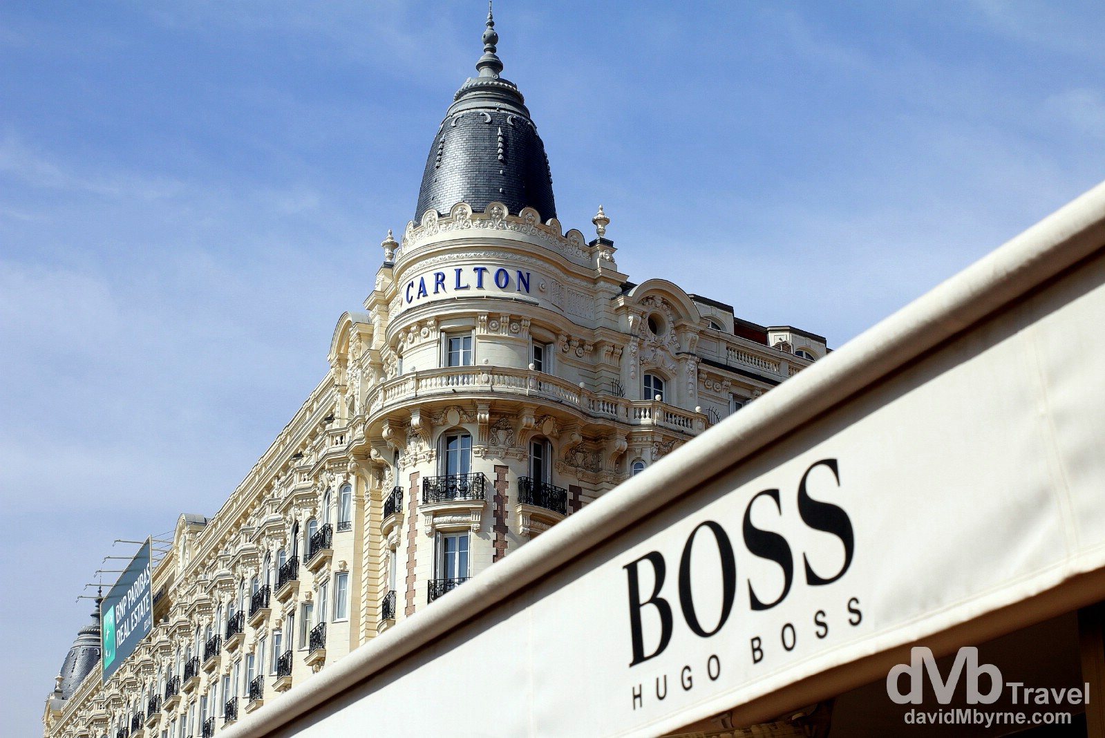 The iconic Carlton Hotel & a Hugo Boss store fronting the waterfront promenade bd de la Croisette in Cannes, Côte d'Azur, France. March 15th, 2014.