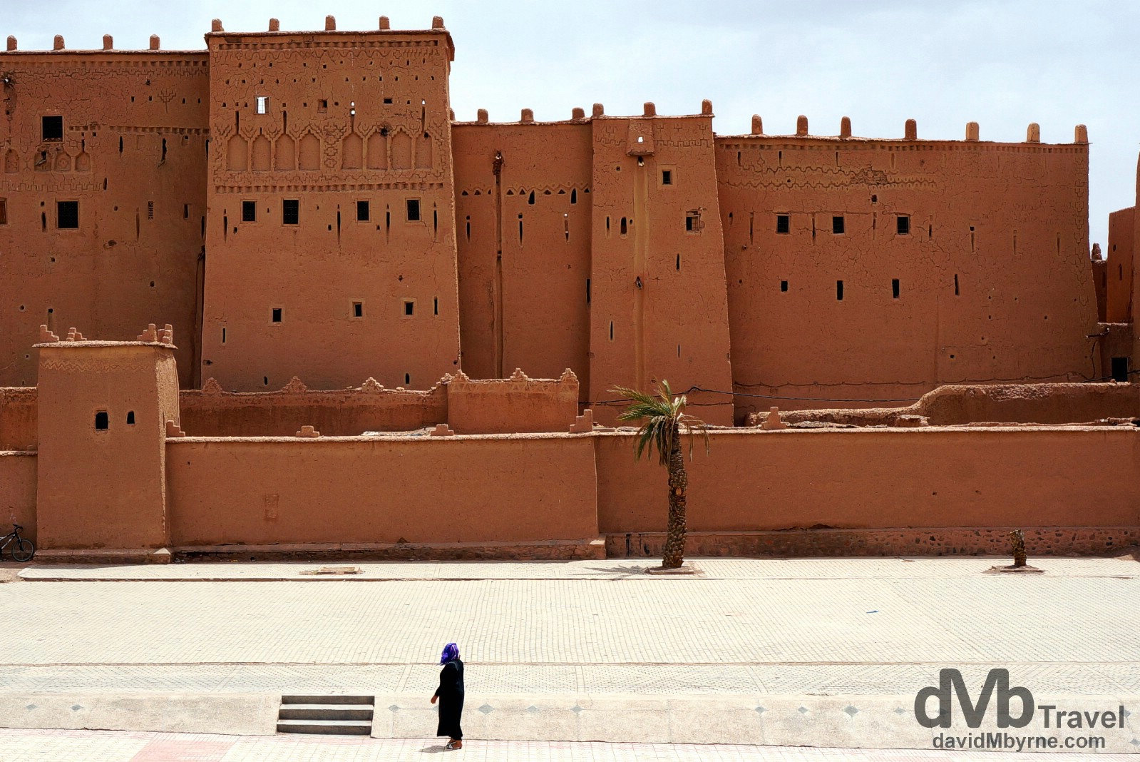 Walking in front of the walls of the Kasbah Taourirt in Ouarzazate, Morocco. May 13th, 2014.