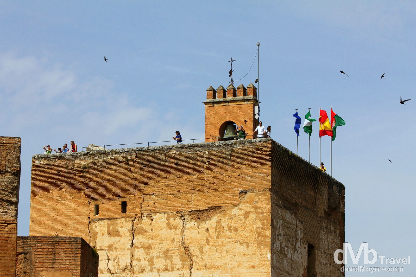 People atop the Torre de la Vela (Watchtower) in the Alcazaba (Citadel) in Granada, Andalusia, Spain. June 11th, 2014.