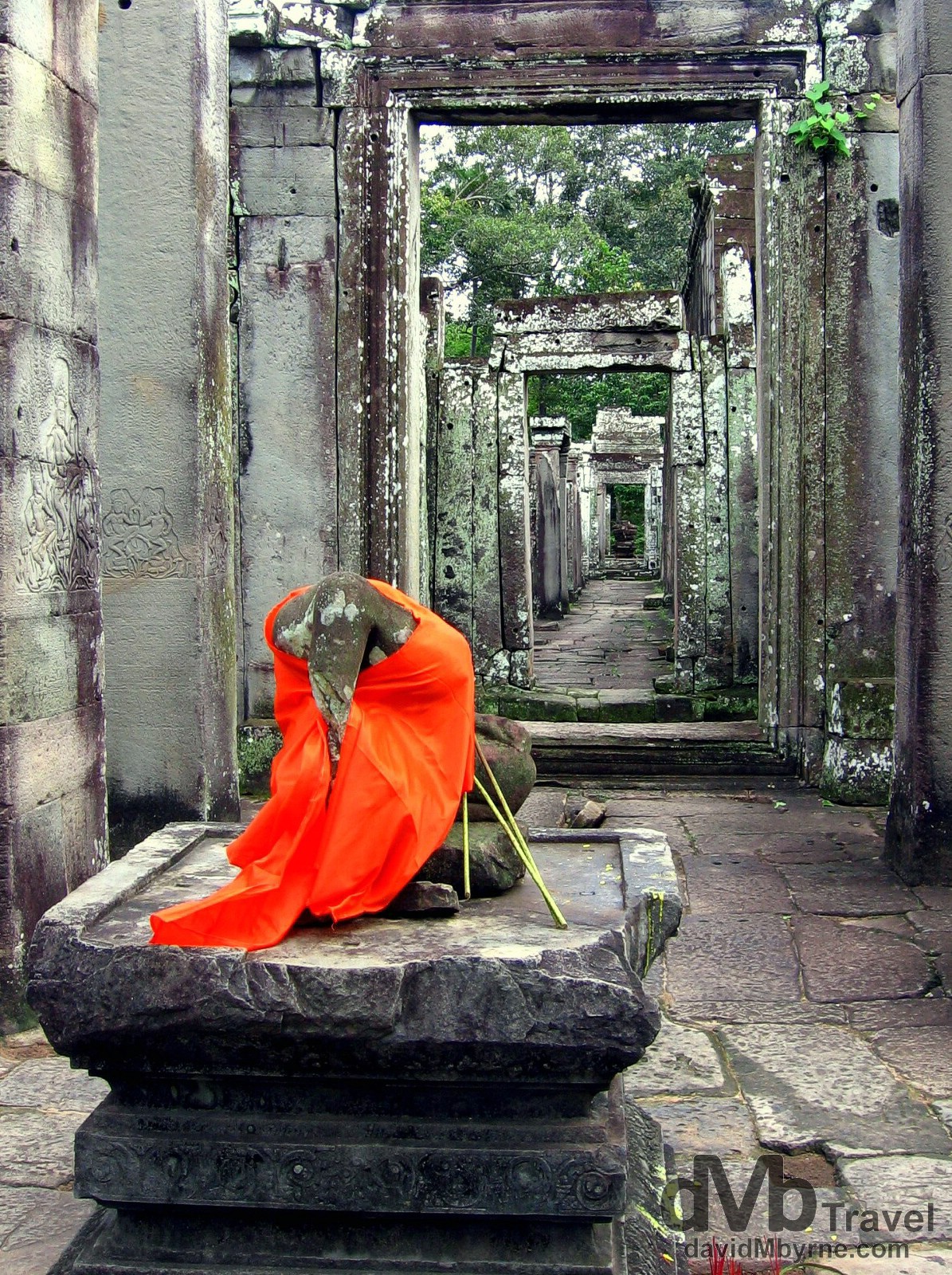 A headless Buddha in the ruins of the temples of Angkor, Cambodia. September 20th, 2005. 