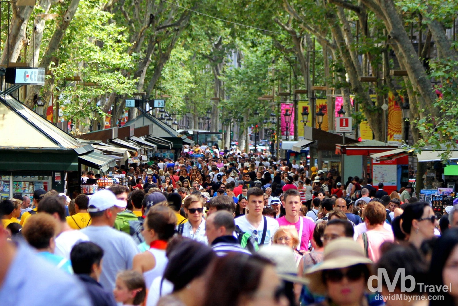 People on Spain's most famous street, La Rambla. Barcelona, Spain. June 18th, 2014.