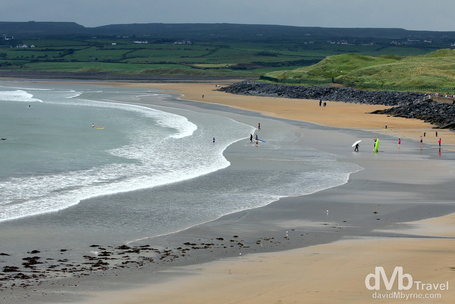 Surfers in the water of the beach in Lahinch. Co. Kerry, Ireland. August 27, 2014.