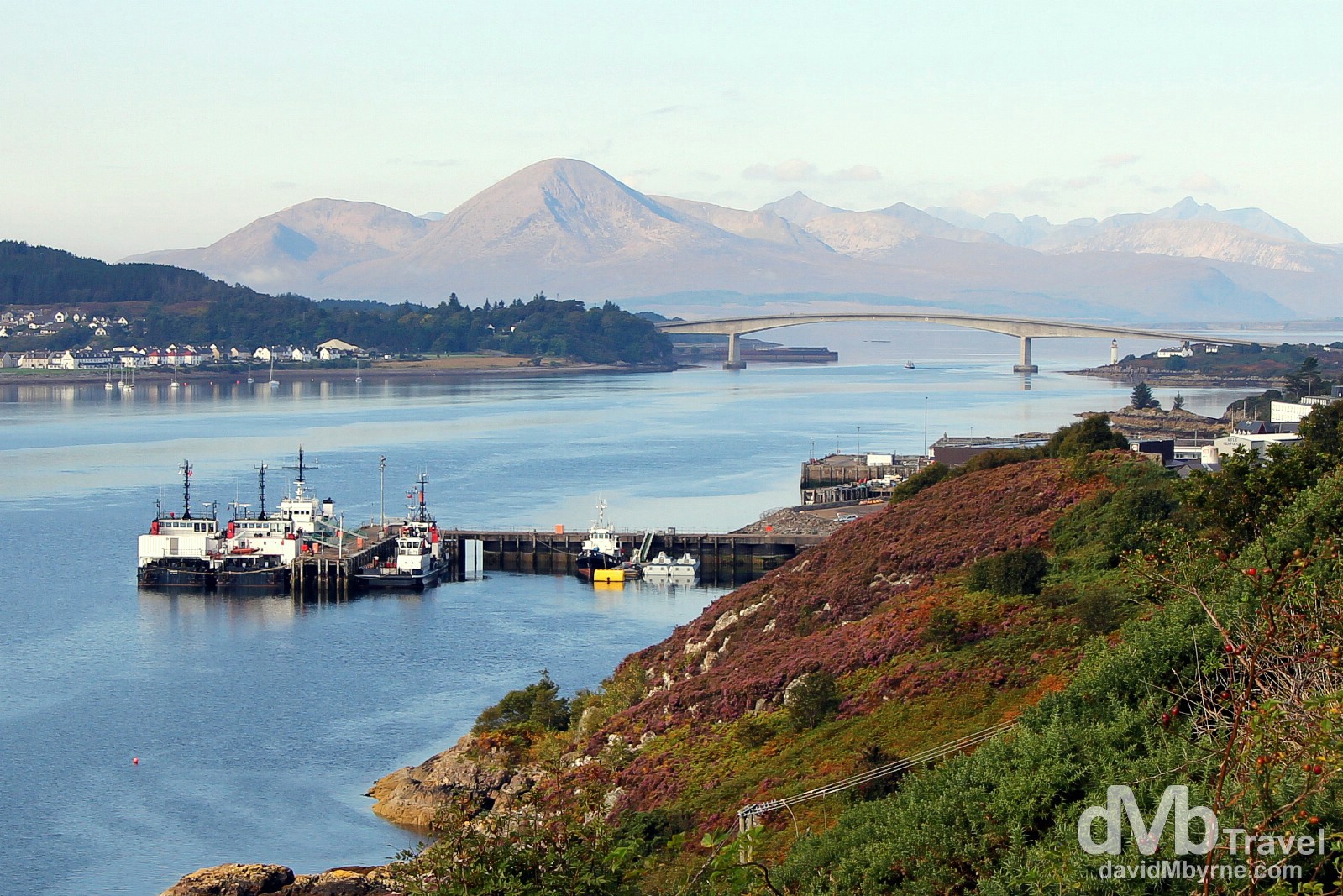 The mountains of the Isle of Skye & The Skye Bridge spanning Loch Alsh as seen from the A87 entering Kyle of Lochalsh, Highland, Scotland. September 17, 2014.