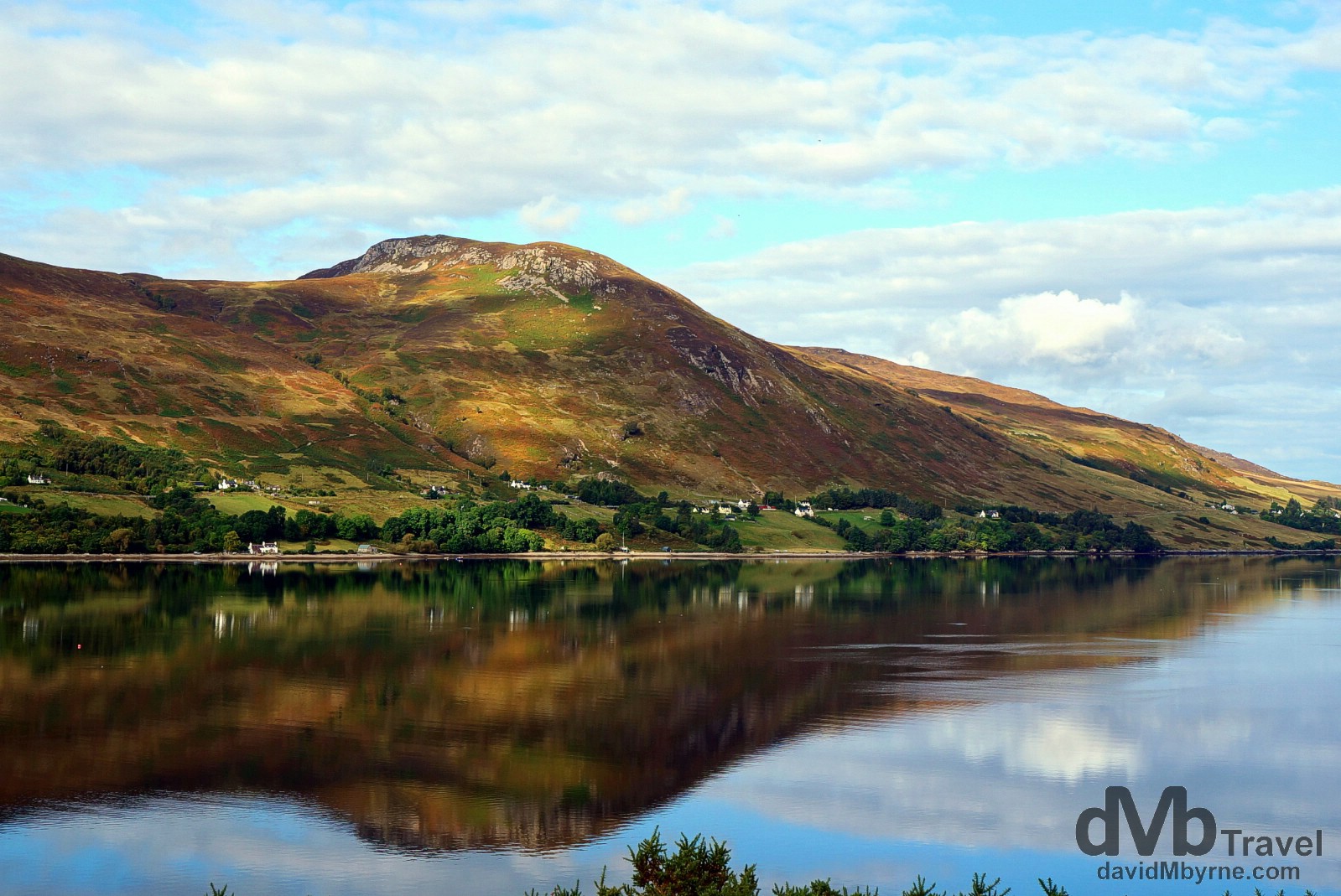 Reflections of the western shore of Lock Broom, Highlands, Scotland. September 16, 2014.