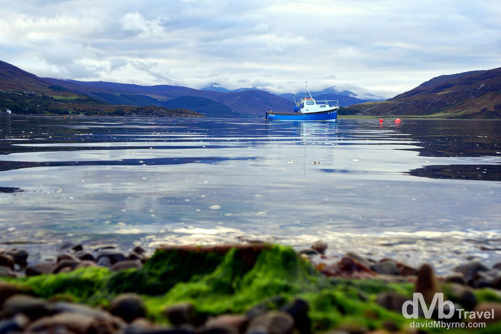 A lone boat in the harbour of Ullapool, Highlands, Scotland. September 16, 2014. 