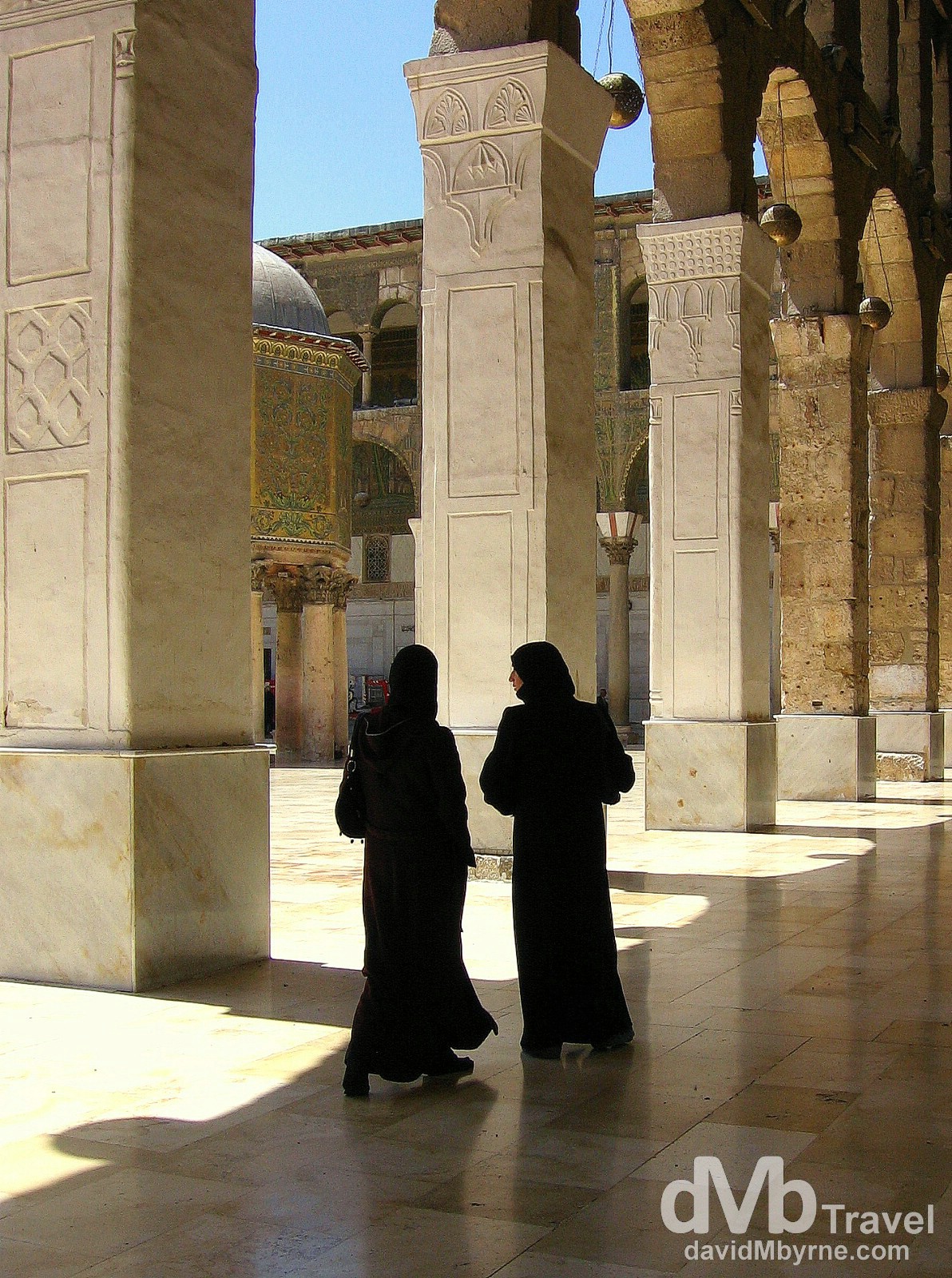 Two visitors in the courtyard of The Umayyad Mosque, aka The Great Mosque of Damascus, in Damascus, Syria. May 5, 2008. 
