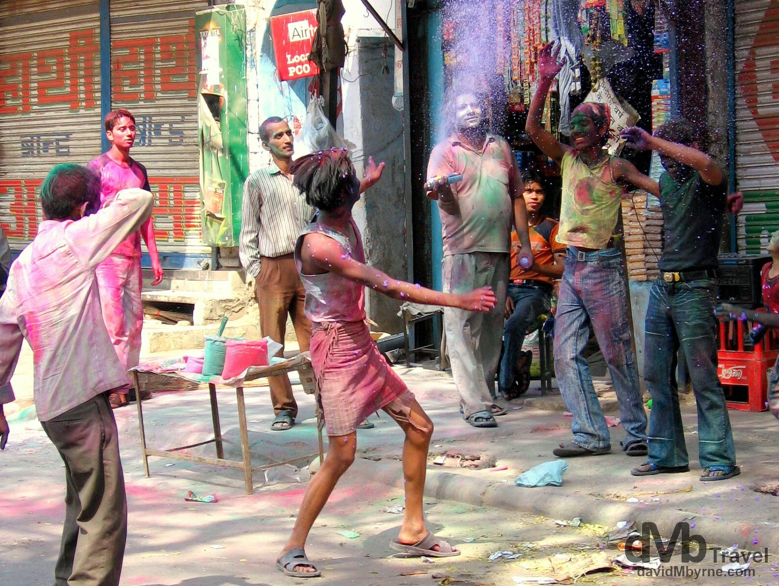 Indians enjoying the Hindu Colour Festival on the Main Bazaar of Paharganj. Delhi, India. March 22, 2008.