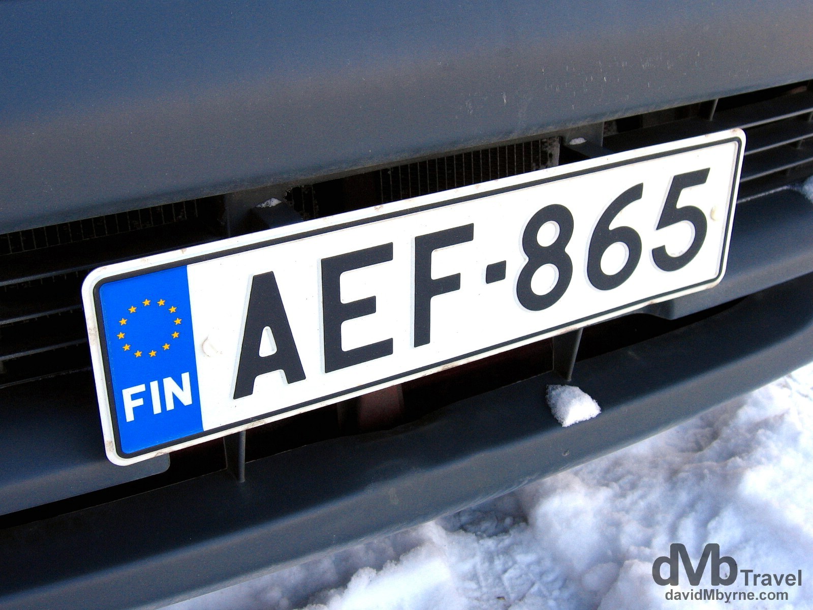 A car license plate on the snowy streets of Helsinki, Finland. March 1, 2006.