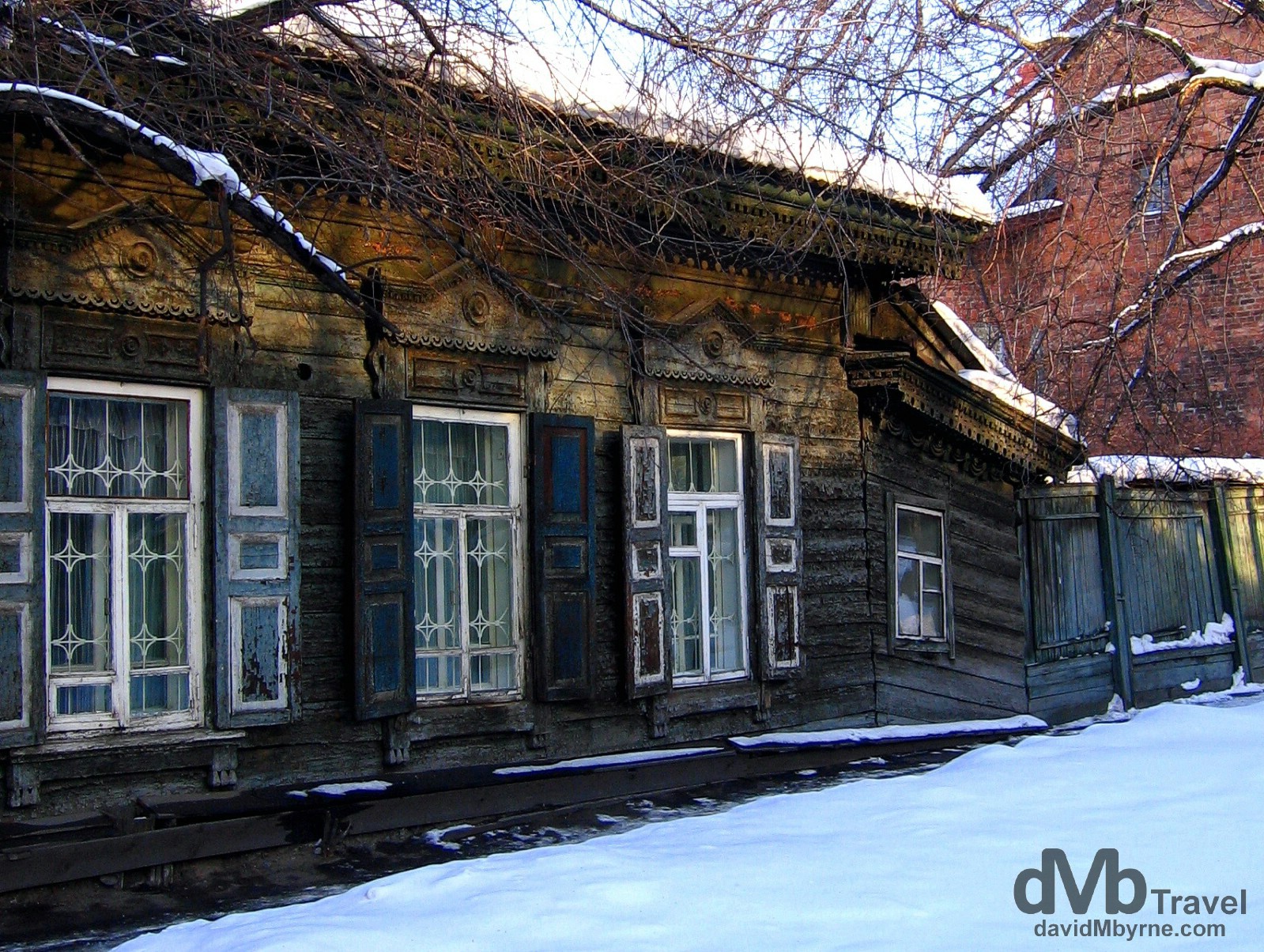 Crumbling wooden buildings on Ul Chkalova, Irkutsk, Siberian Russia. February 17, 2006.