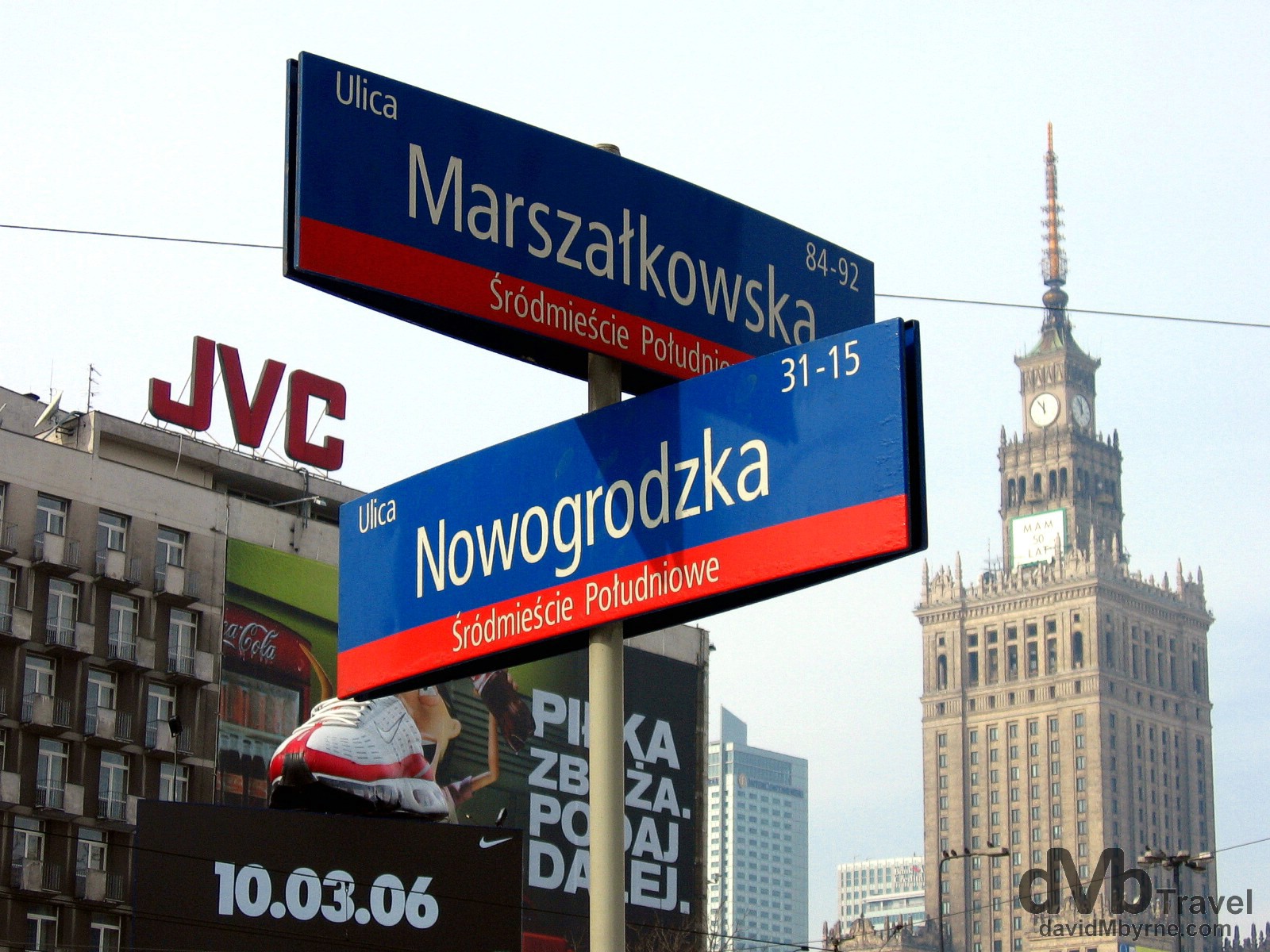 Street signage & the massive tower of the Palace of Culture & Science building as seen from outside Centrum Metro Station in Warsaw, Poland. March 5, 2006.