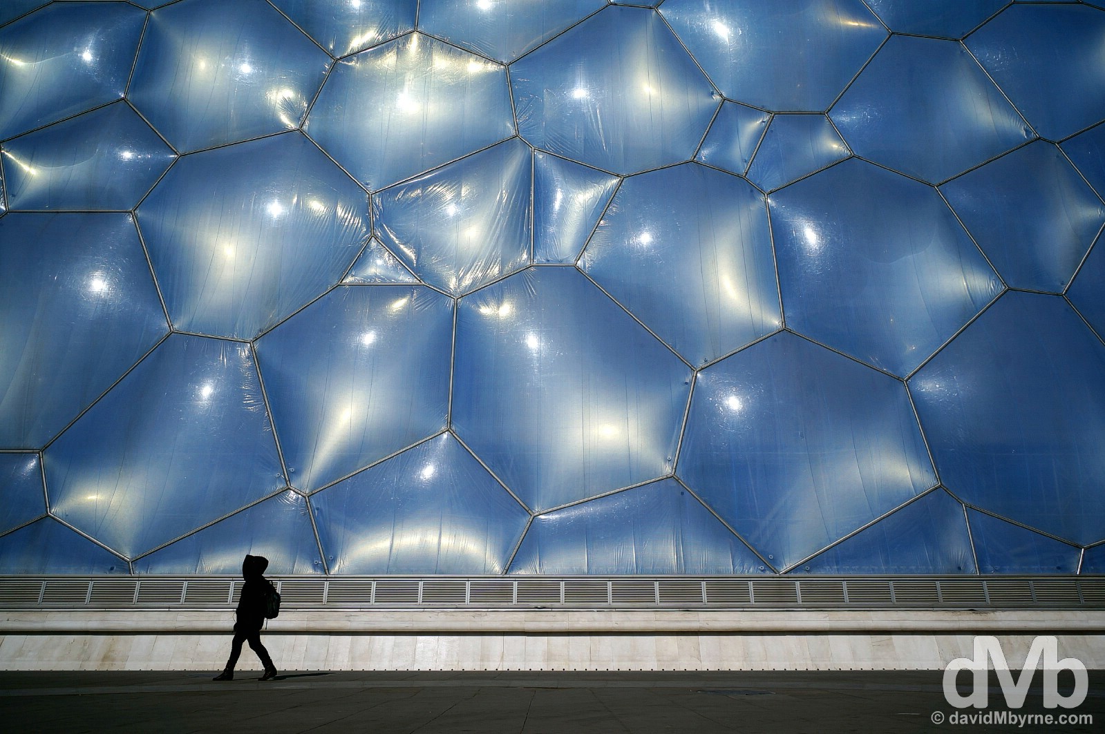 Walking past the National Aquatic Centre, a.k.a. the Water Cube, in Beijing Olympic Park, Beijing, China. February 5, 2015.