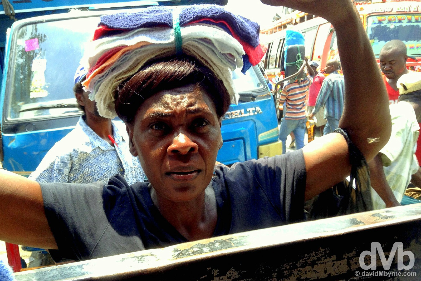 A vendor peddling her wares to bus passengers in Port-au-Prince, Haiti. May 19, 2015.