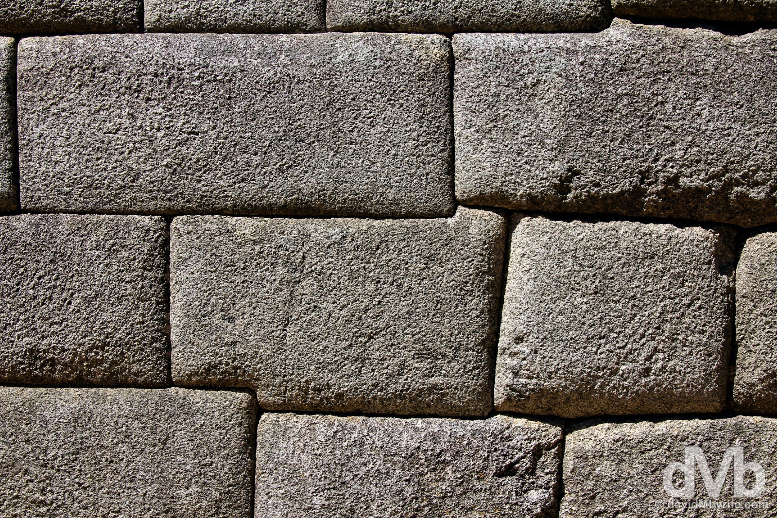 An example of rectangular convex Inca style brickwork of the site’s main temple, the Temple of the Sun, a semi-circular, stunted tower-like structure that displays some of Machu Picchu’s finest granite stonework. Machu Picchu, Peru. August 15, 2015. 