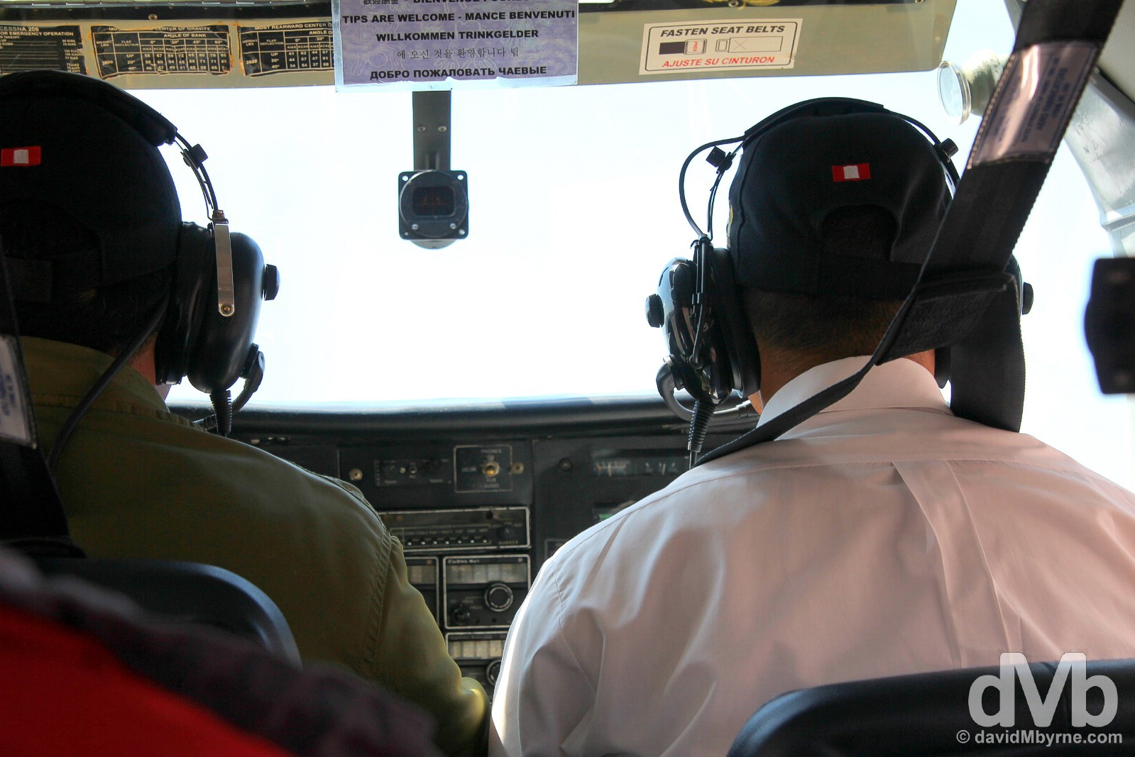 Pilot & copilot in the compact cockpit of a Cessna C206 over the Nasca Plain in southern Peru. August 11, 2015. 