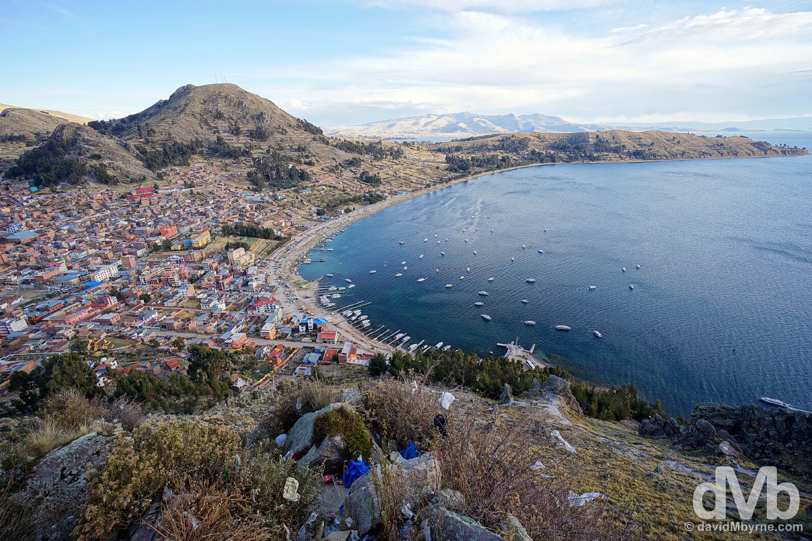 The town of Copacabana on the shores of Lake Titicaca as seen from the pilgrimage mountain Cerro Calvario. Copacabana, Bolivia. August 23, 2015. 