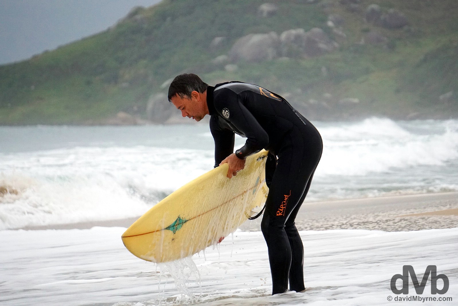 A surfer on Praia Mole on Ilah Santa Catarina, Brazil. September 17, 2015.
