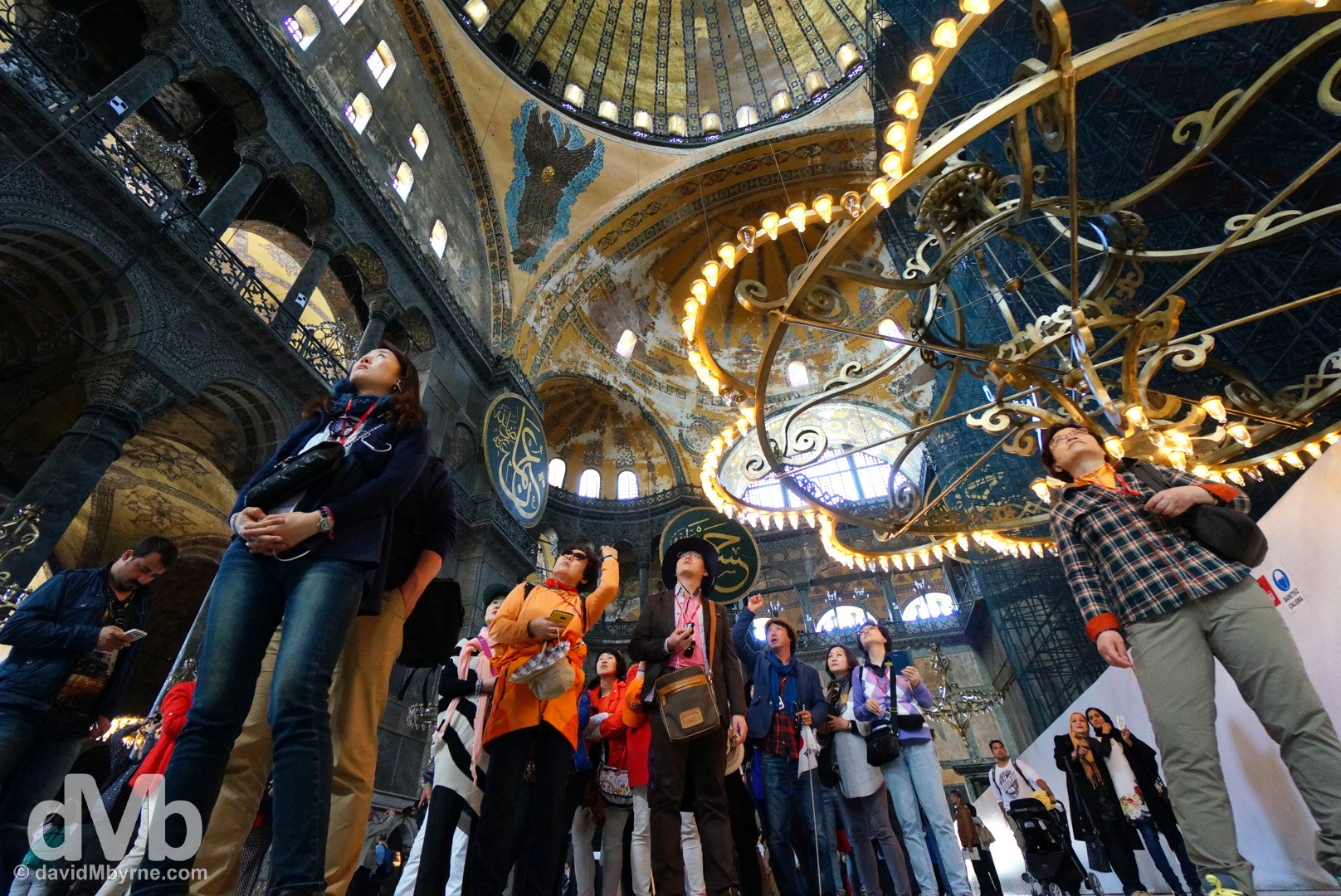 A group of flag-following Korean tourists admiring the interior of the Hagia Sophia in Istanbul, Turkey. April 10, 2014.